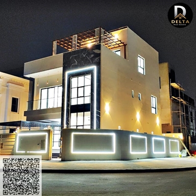 A European-style villa featuring striking glass windows and black stone, giving it a breathtaking appearance. Ideal for those seeking a modern design.