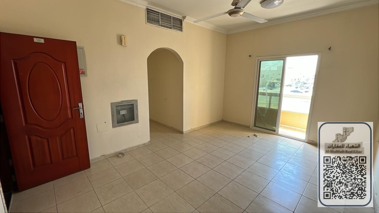 One bedroom and living room in Al Muwaihat, on a main street, with a balcony offering an open view.
