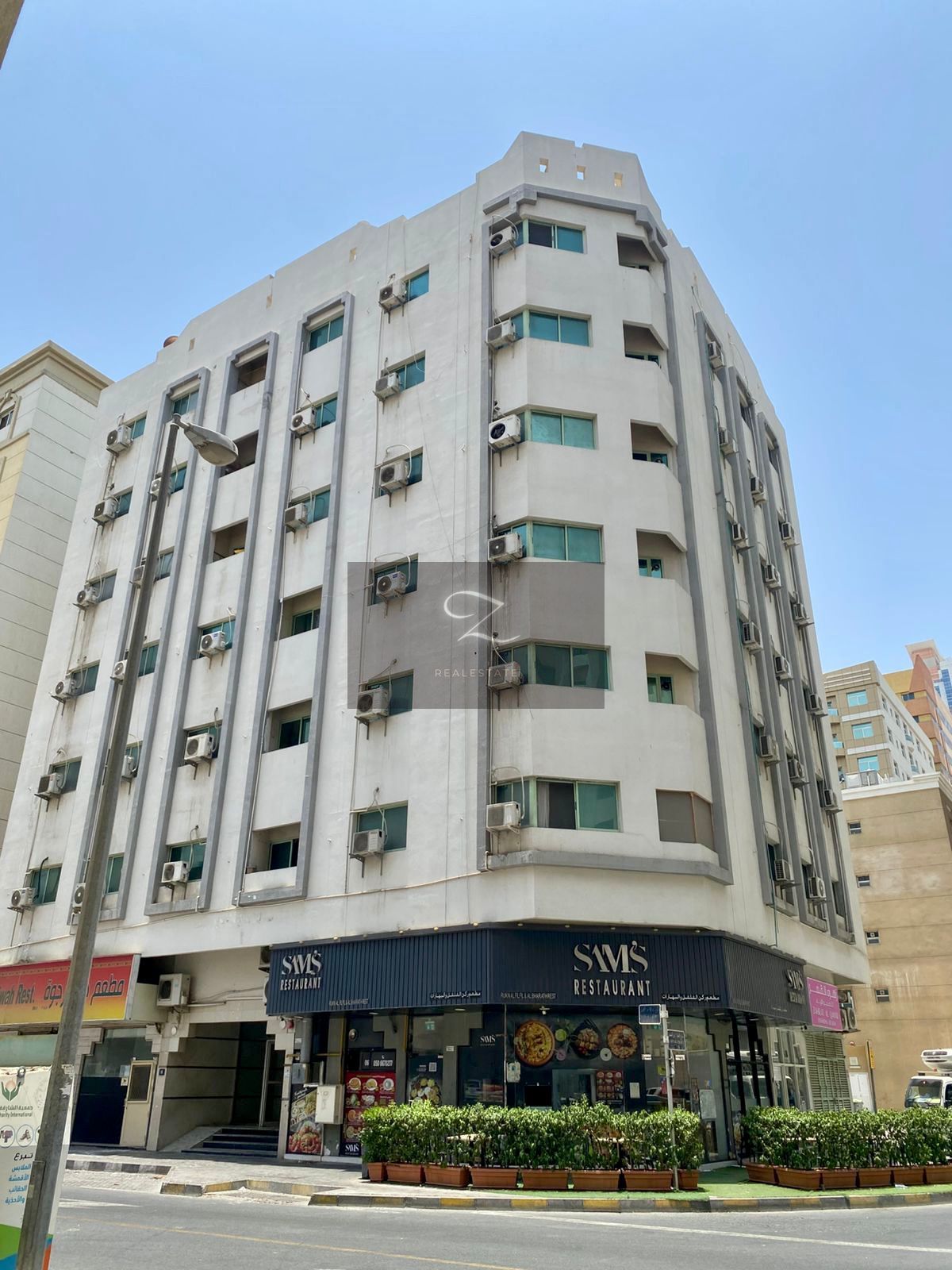 For sale: Residential and commercial corner building in Sharjah / Al Qasimia