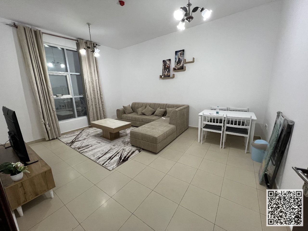 With an open view, a furnished two-bedroom apartment with a living room for monthly rent in Ajman, City Towers. Includes bills, internet, parking.