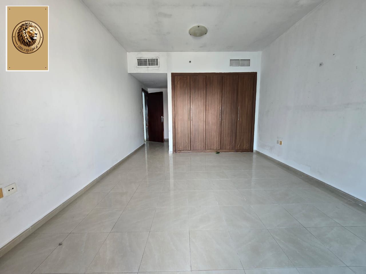 For annual rent in Al Rashidiya 3: One bedroom, living room, two bathrooms, and a spacious balcony. Central air
