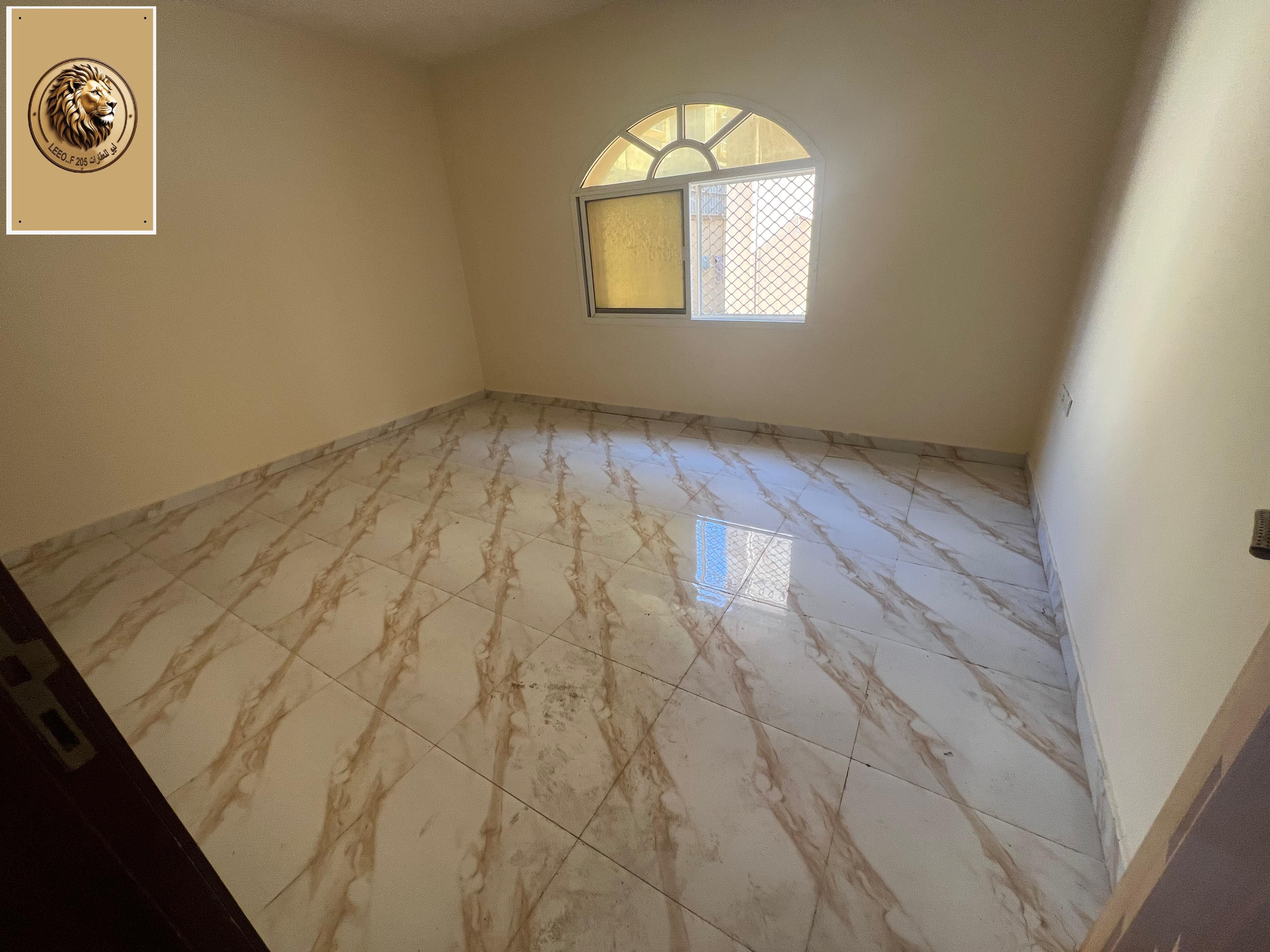 Two rooms and a ground floor hall for rent in Al Mowaihat 3 - strategic location and special price.