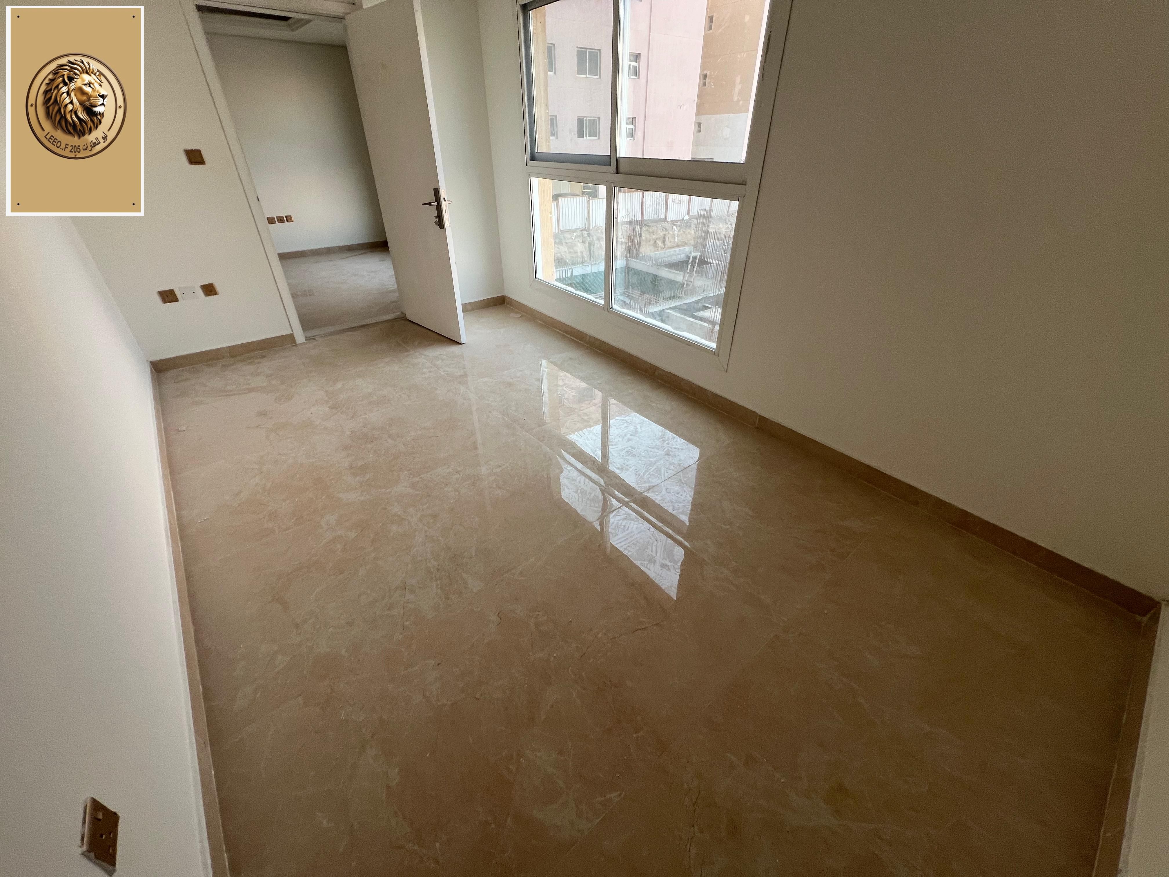 Upscale two-bedroom apartment with a living room, gym, and swimming pool, near Dubai exit.