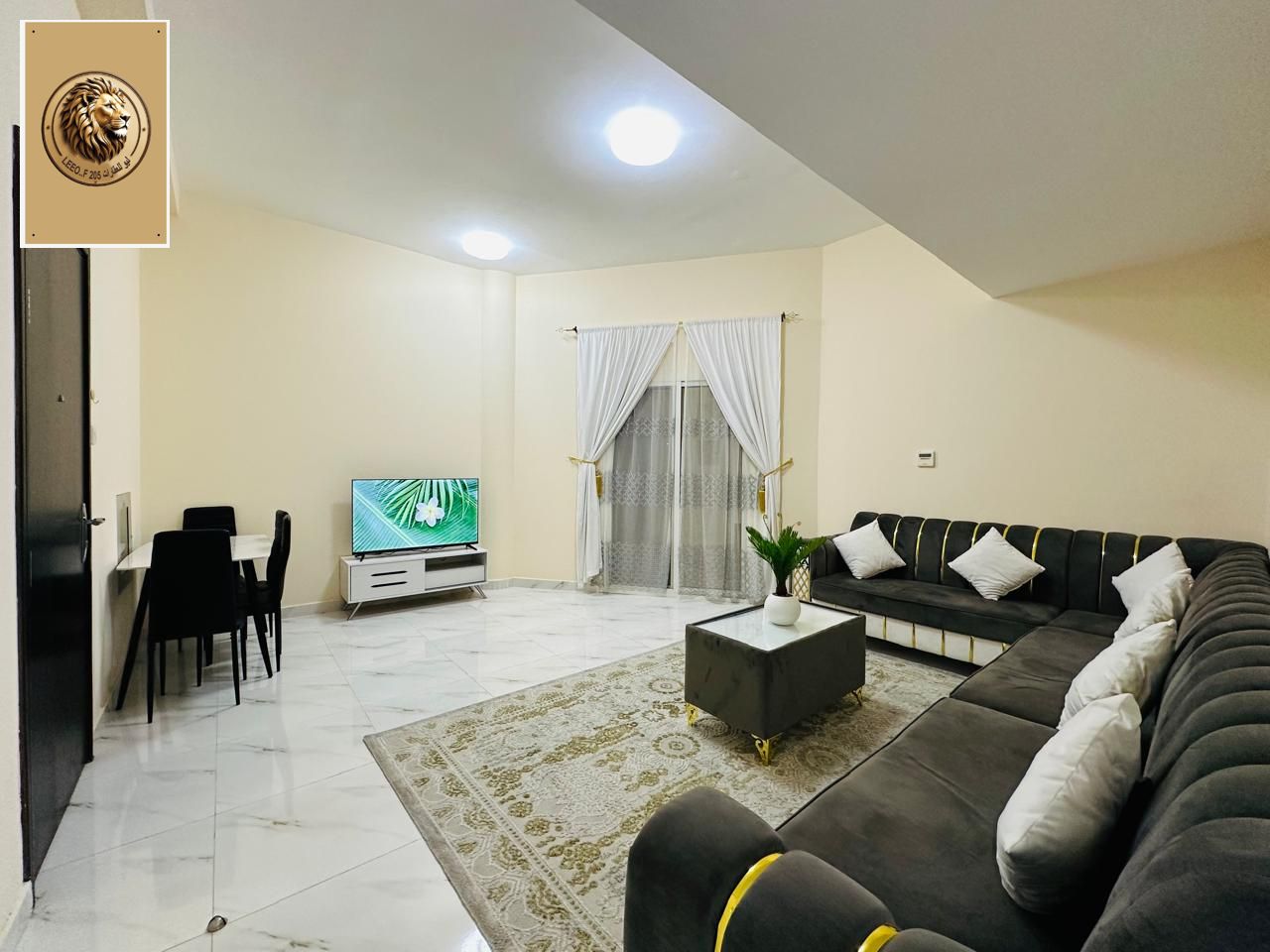Furnished two-bedroom apartment with a living room for monthly rent, located in a prime tourist area on Ajman Corniche