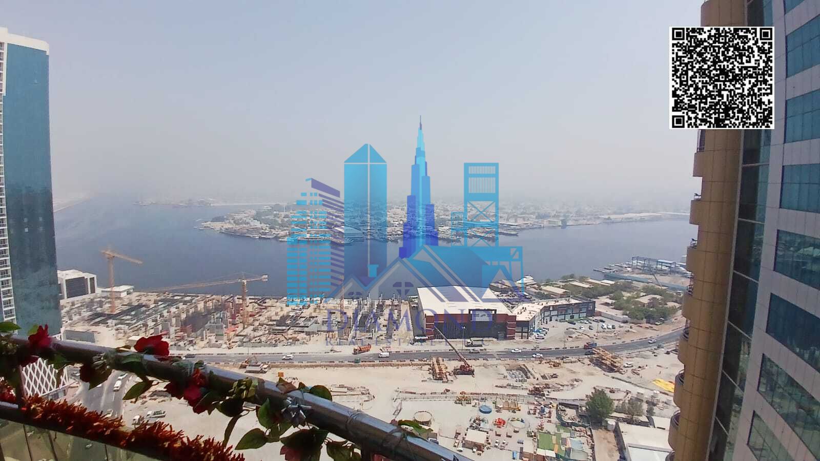 For sale with furniture, an empty apartment with two rooms and a hall, an open view of the creek, owned by Harb, Horizon Towers, Ajman Emirate.