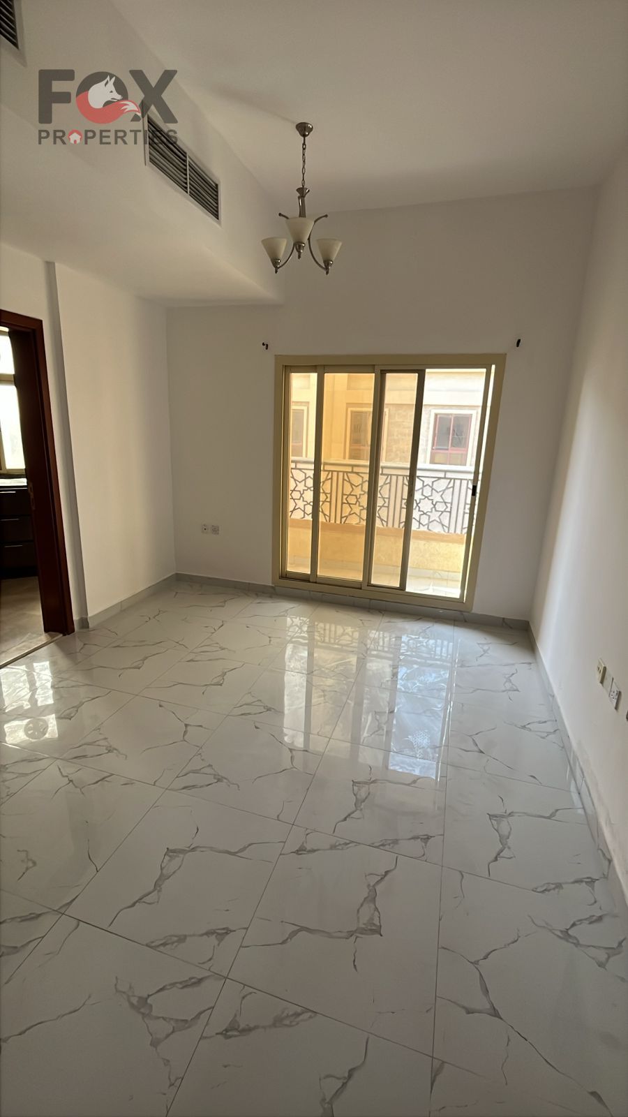 One-bedroom apartment with a living room for annual rent in Al-Aaliya area on Sheikh Mohammed bin Zayed Street, easily accessible to Dubai