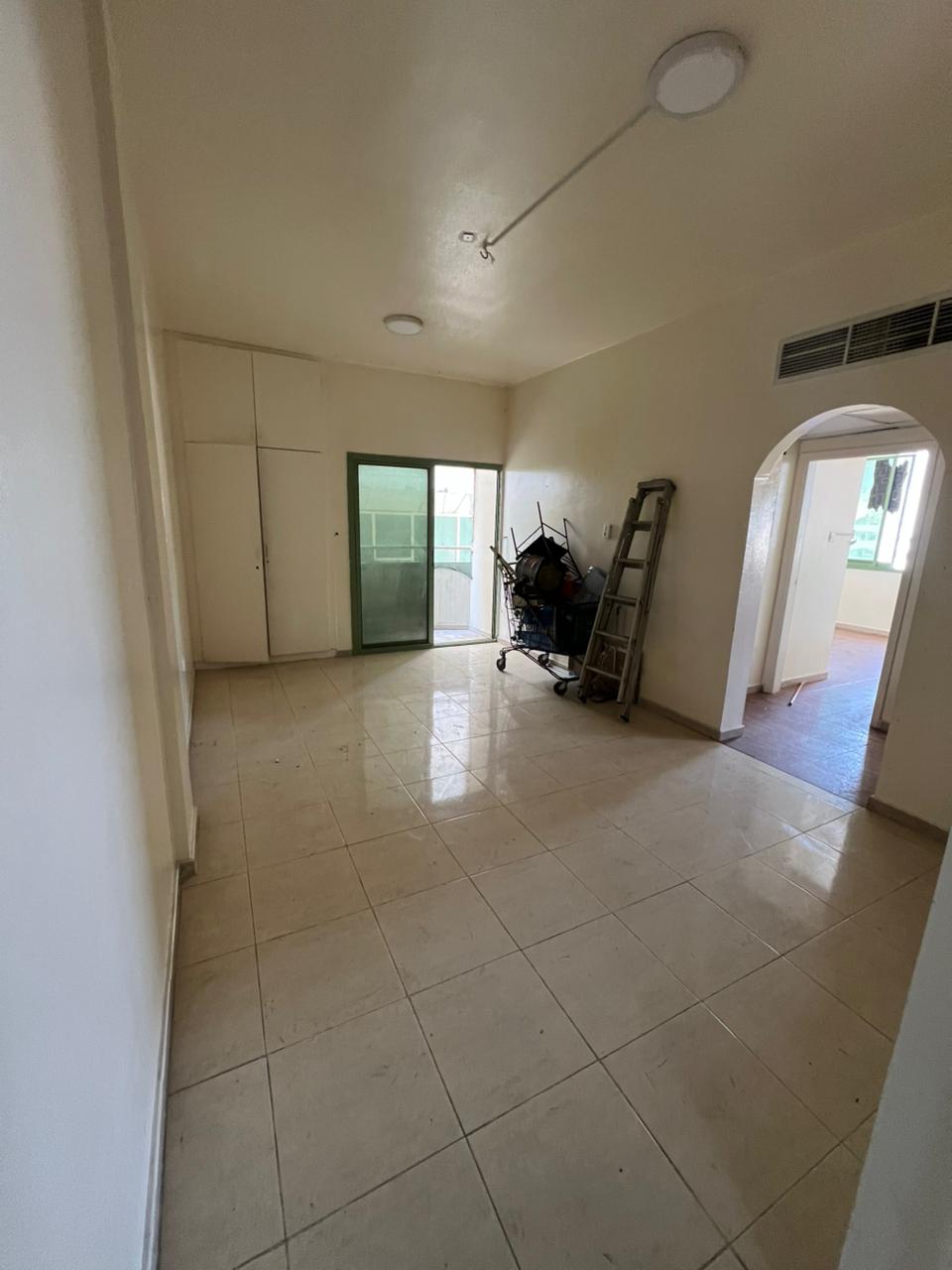 Two-bedroom apartment with balcony in Al Majrah, central AC, family only, 37,000 AED, 6 cheques.