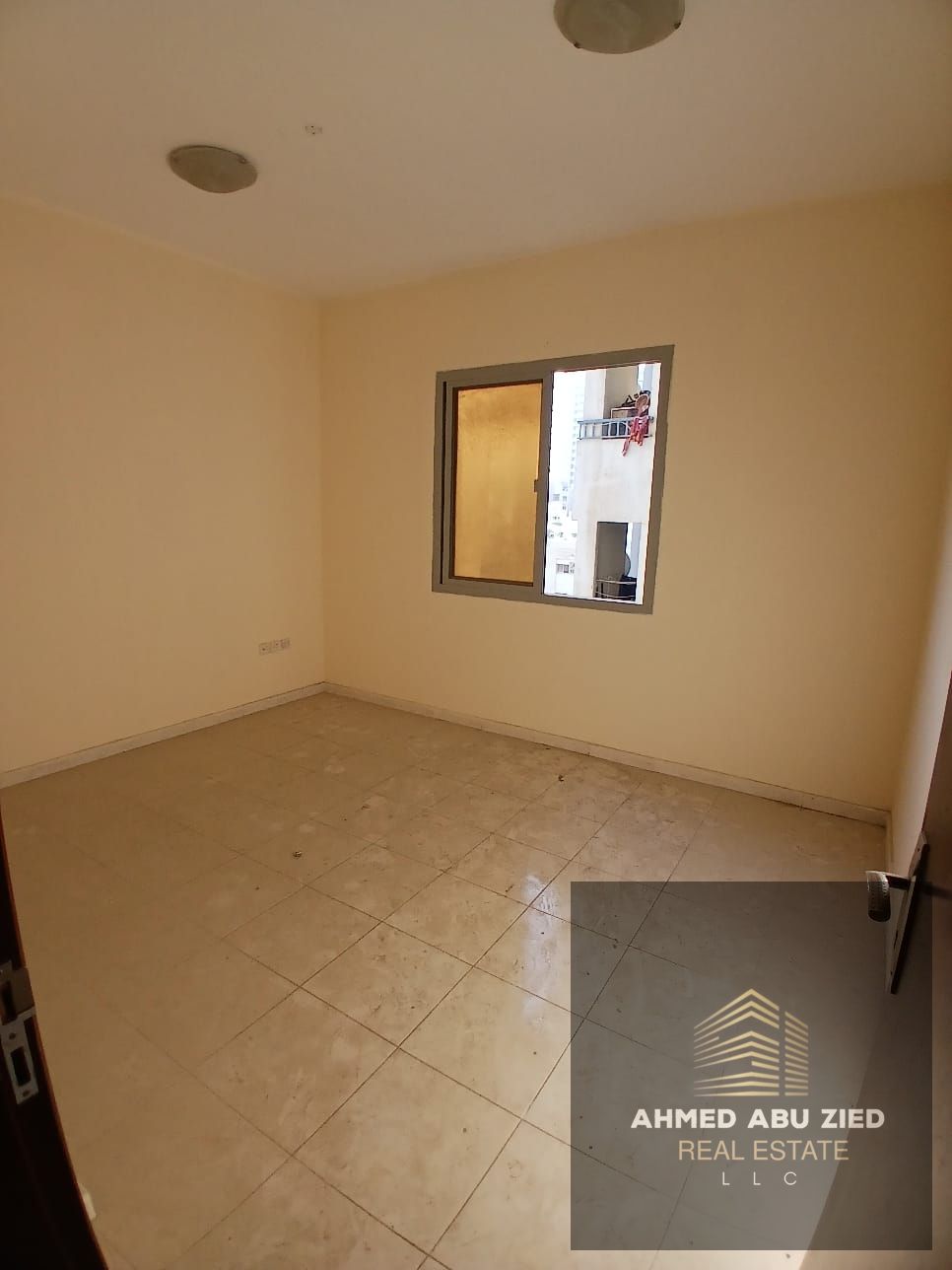 Two-bedroom apartment with a living room for rent in Al Nuaimiya 1, Ajman. Features a balcony, large kitchen, and excellent finishing. Close to amenit