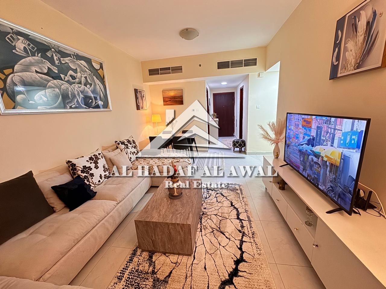 Two bedrooms and a living room in Al Taawun Tower, Hamid, with a children's pool, 6000 with internet and a 1000 security deposit.