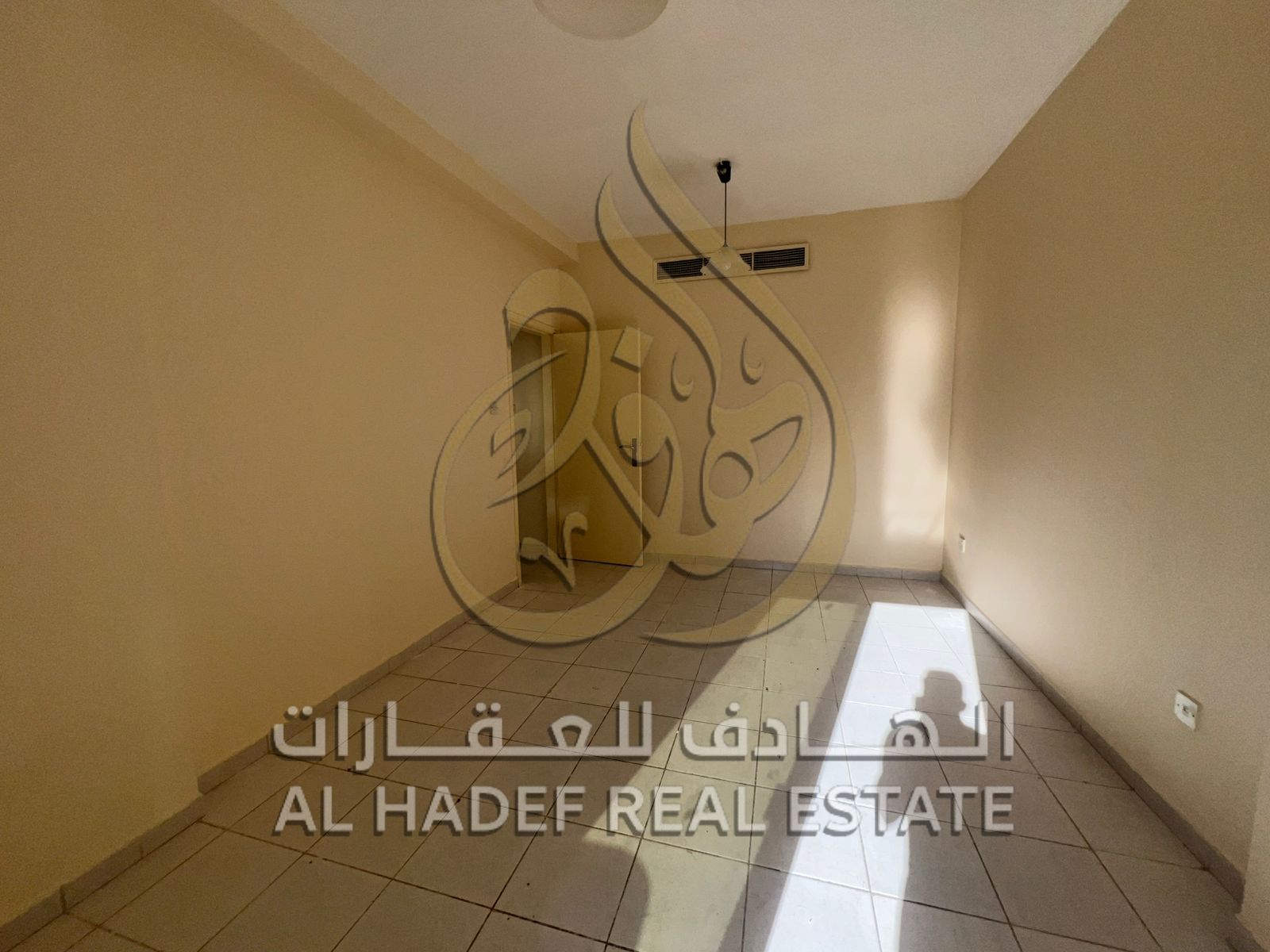 Two-bedroom apartment with a living room and balcony in a prime location near Nesto and all services and transportation.