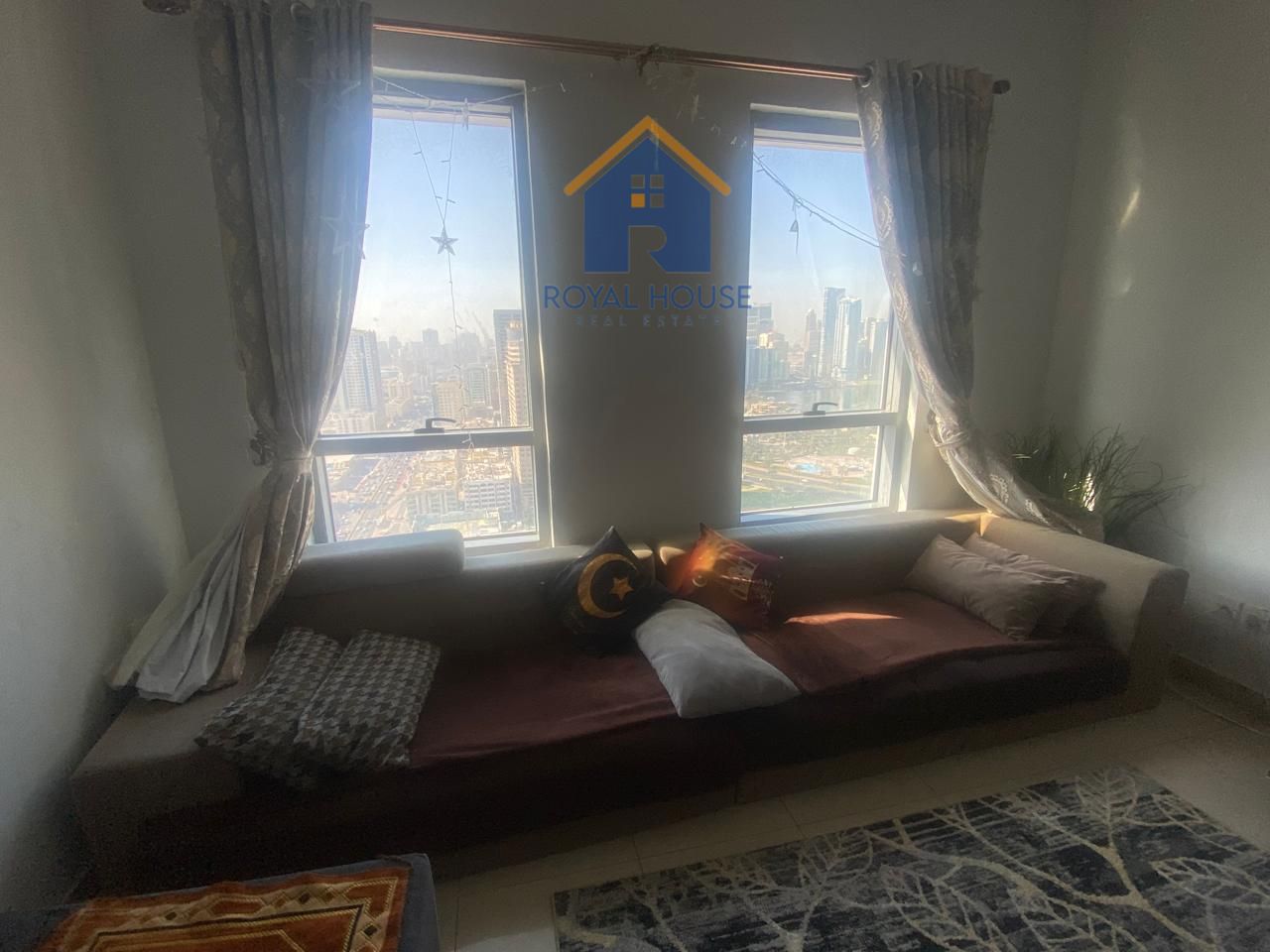 Two bedrooms and a living room in Al Majaz 2, including internet and parking.