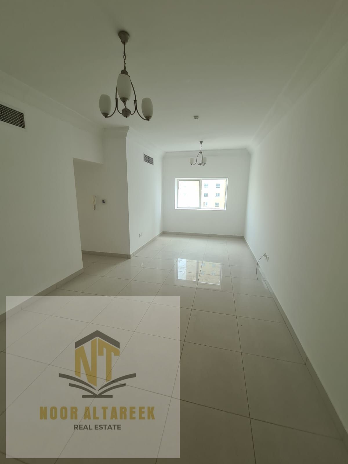 Apartment for rent in Al Khan, featuring a master bedroom, two bathrooms, and a spacious living room. The apartment comes with a deferred security che