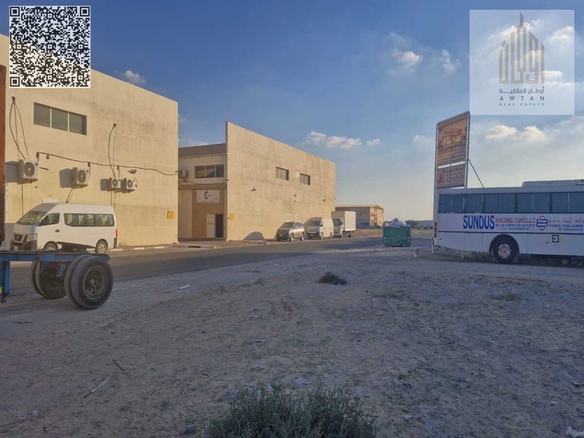 Commercial land on a front and back street and a large alley Commercial land for sale in Ajman Al Jurf Industrial Area 3 Corner of two streets and a