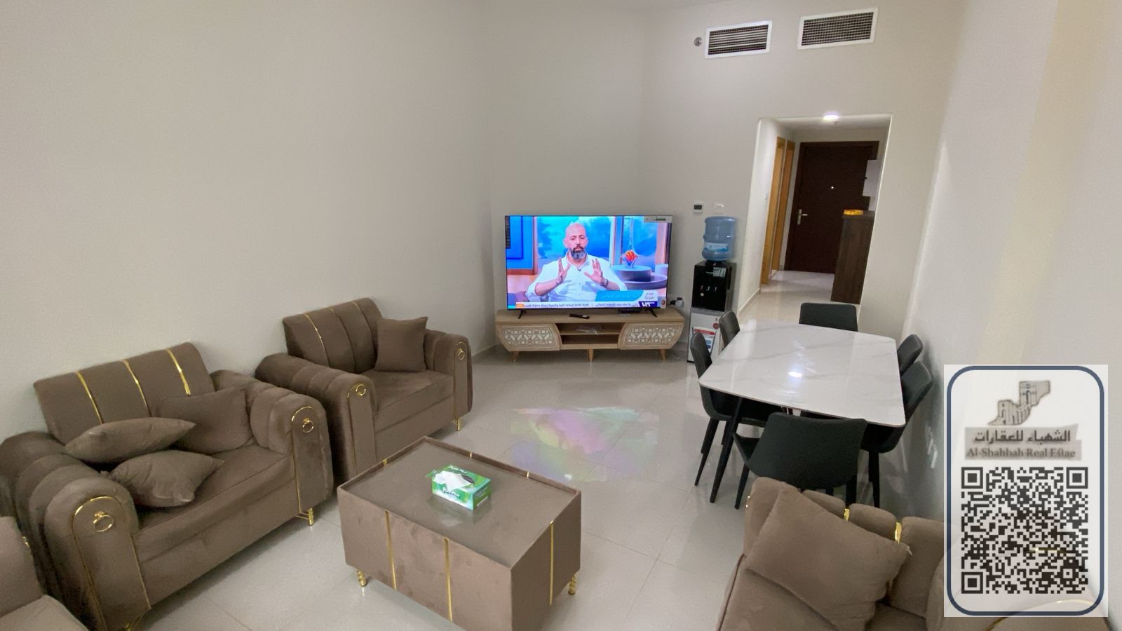 Two bedrooms and a living room in Emirates City, including bills, internet, maintenance, and parking.