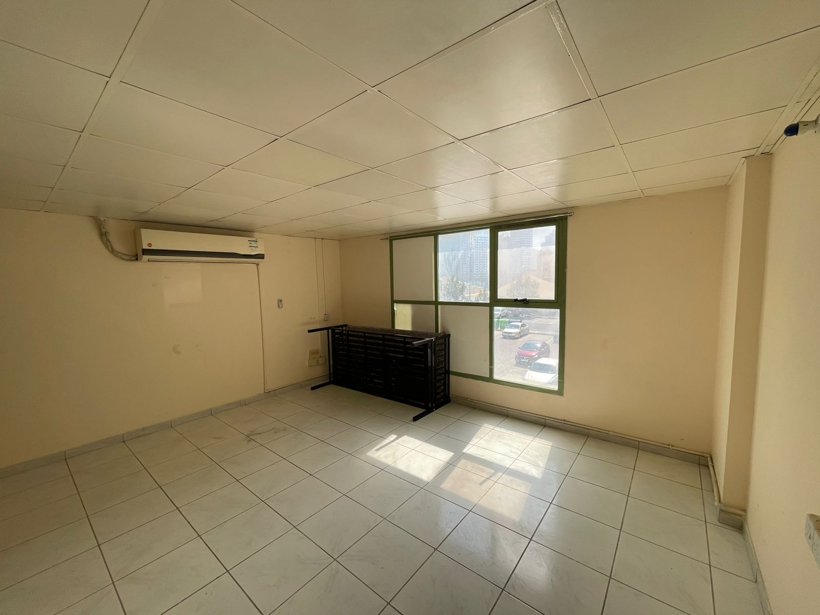 Very spacious studio with a separate kitchen, open view, prime and service-oriented location, close to Dubai exit.