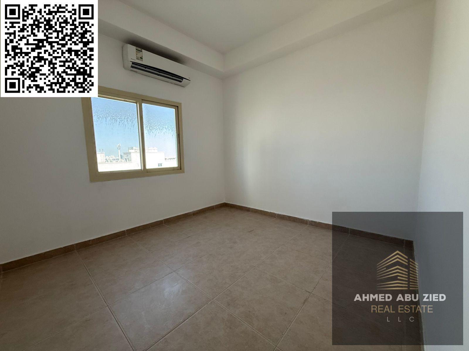 nnual rent in Ajman Al Rawda 2: Spacious 2-master-bedroom apartment + living room, 3 baths, balcony, split AC, free parking, easy 4-installment paymen