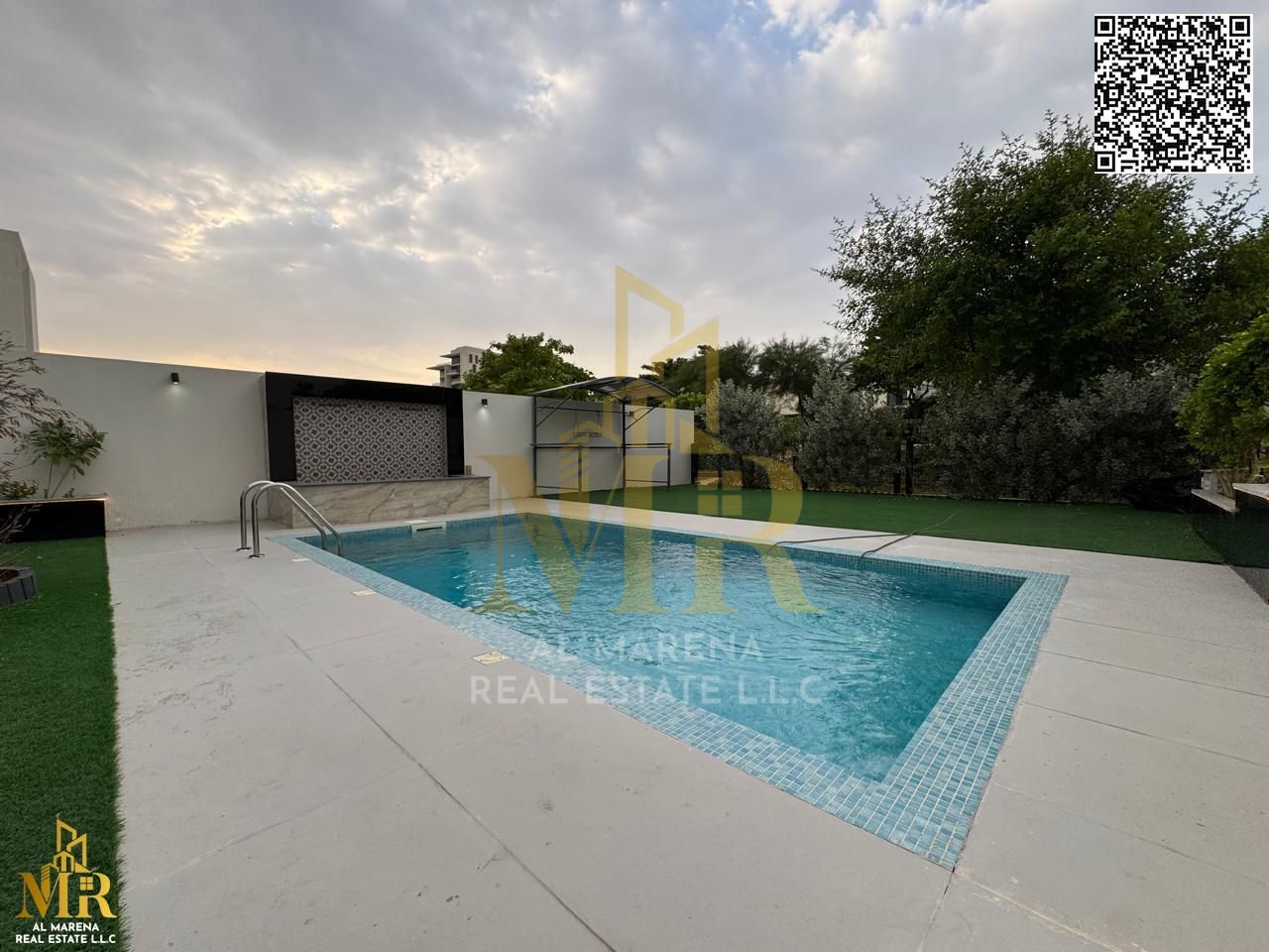 Villa in Al Zorah with partial golf and lake view, 4 bedrooms, private backyard and pool, price includes AC, electricity, and water.