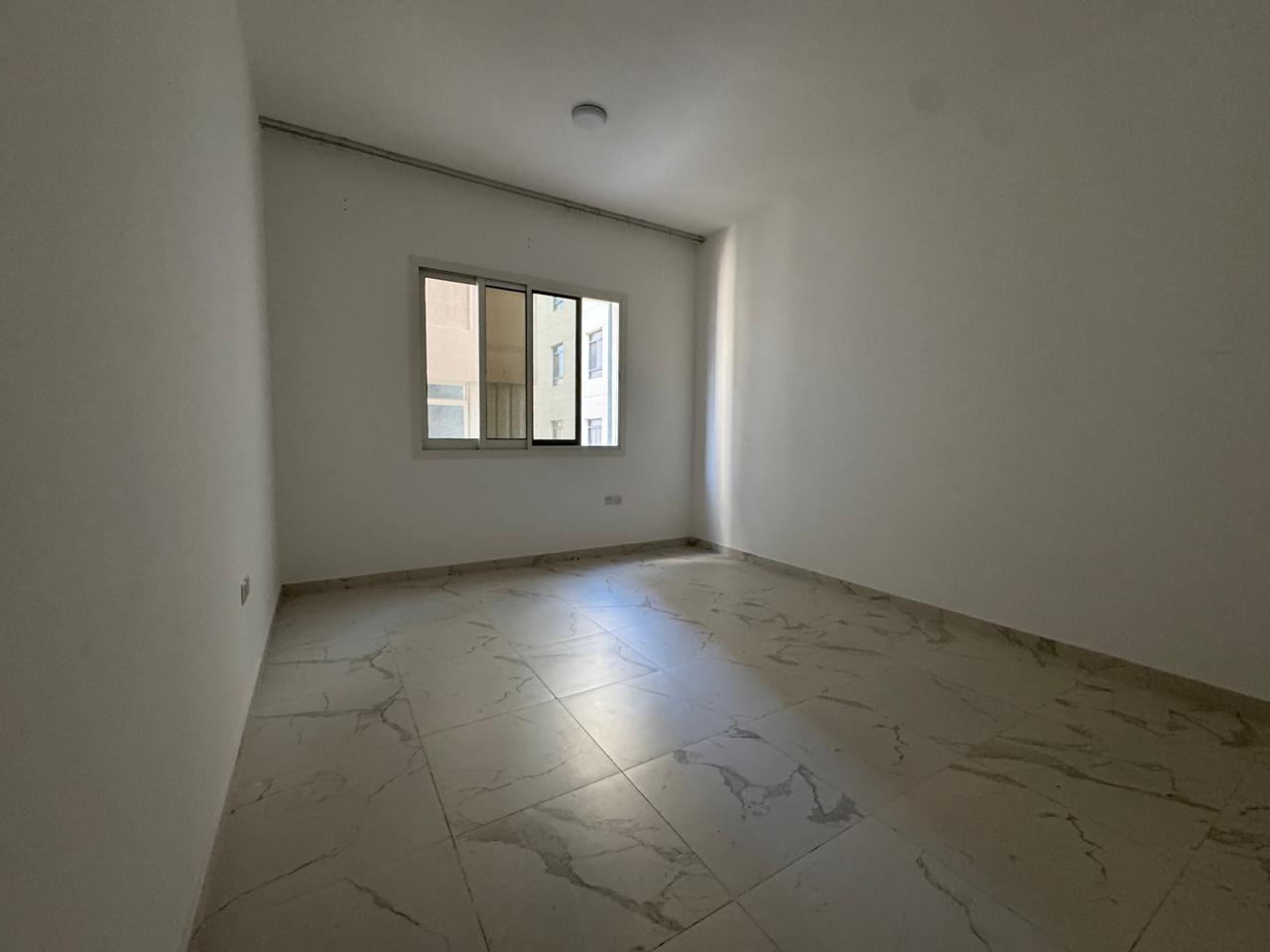 1 Bedroom Hall Apartment for Rent in Al Jurf 2, Ajman, Master Room, 2 Bathrooms, Balcony with Excellent View, Central AC, Built-in Wardrobes