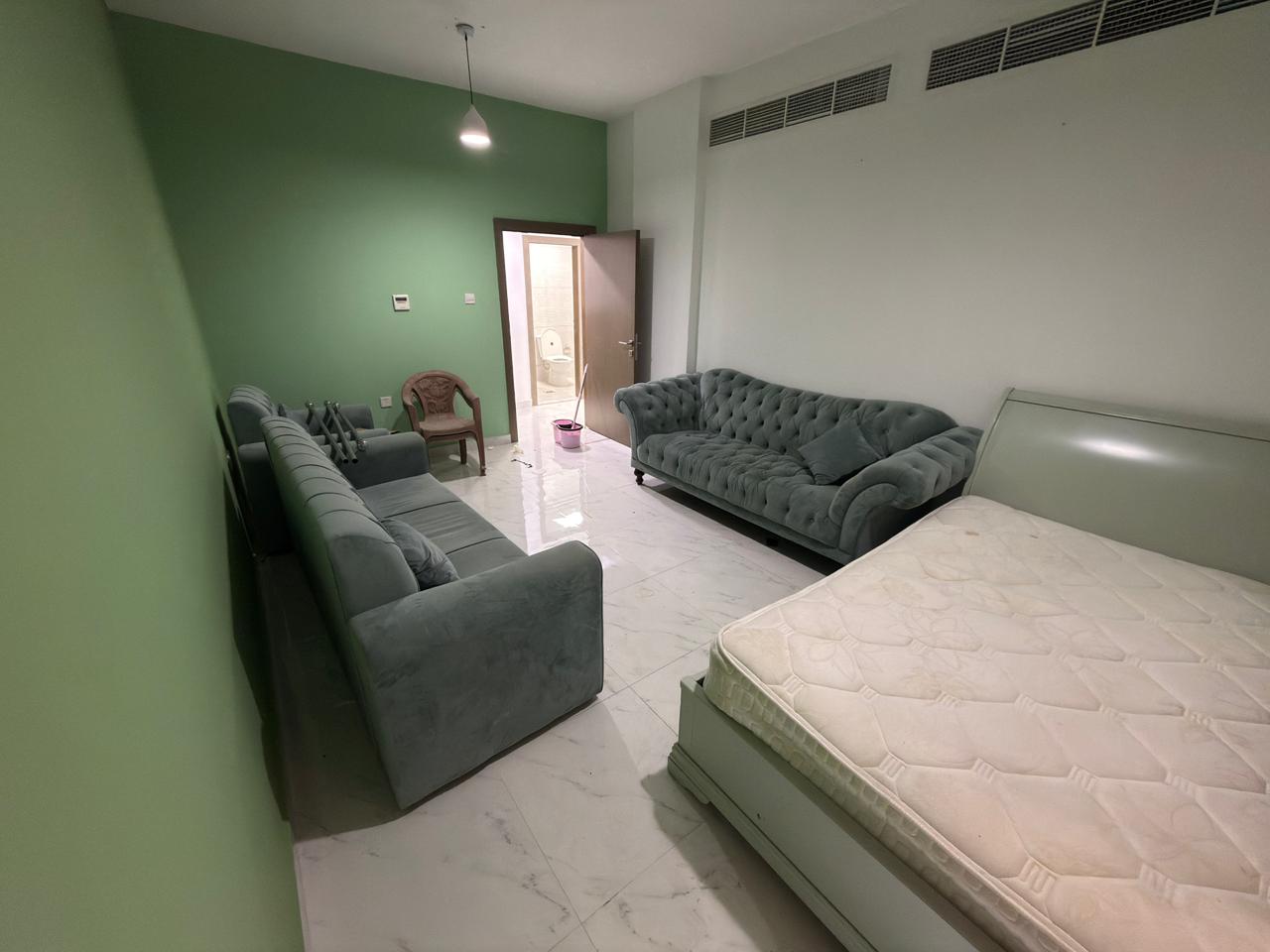 Two bedrooms and a living room, second tenant, for annual rent in Al Jurf 3, Ajman, near the Chinese market. New building with professional finishes.