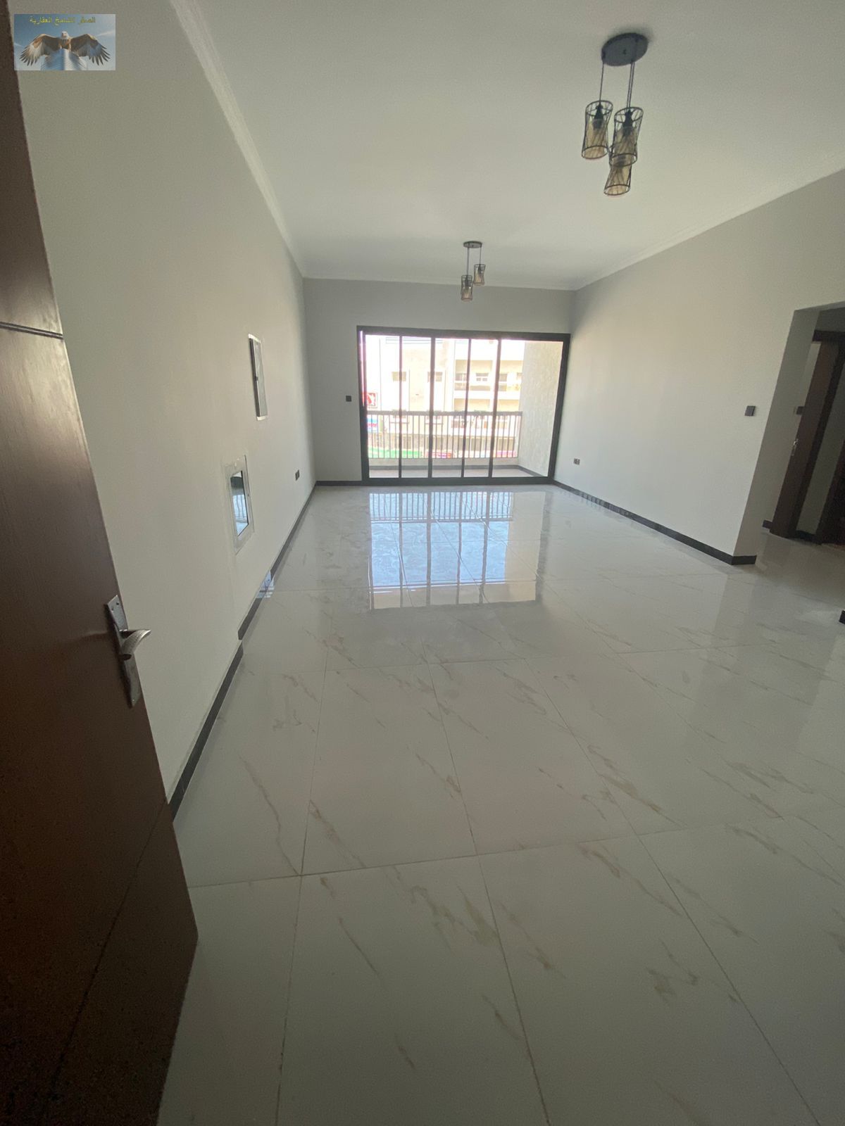 Beautiful two-bedroom apartment with a master living room, in a prime location, elegant design, and easy access to Dubai.