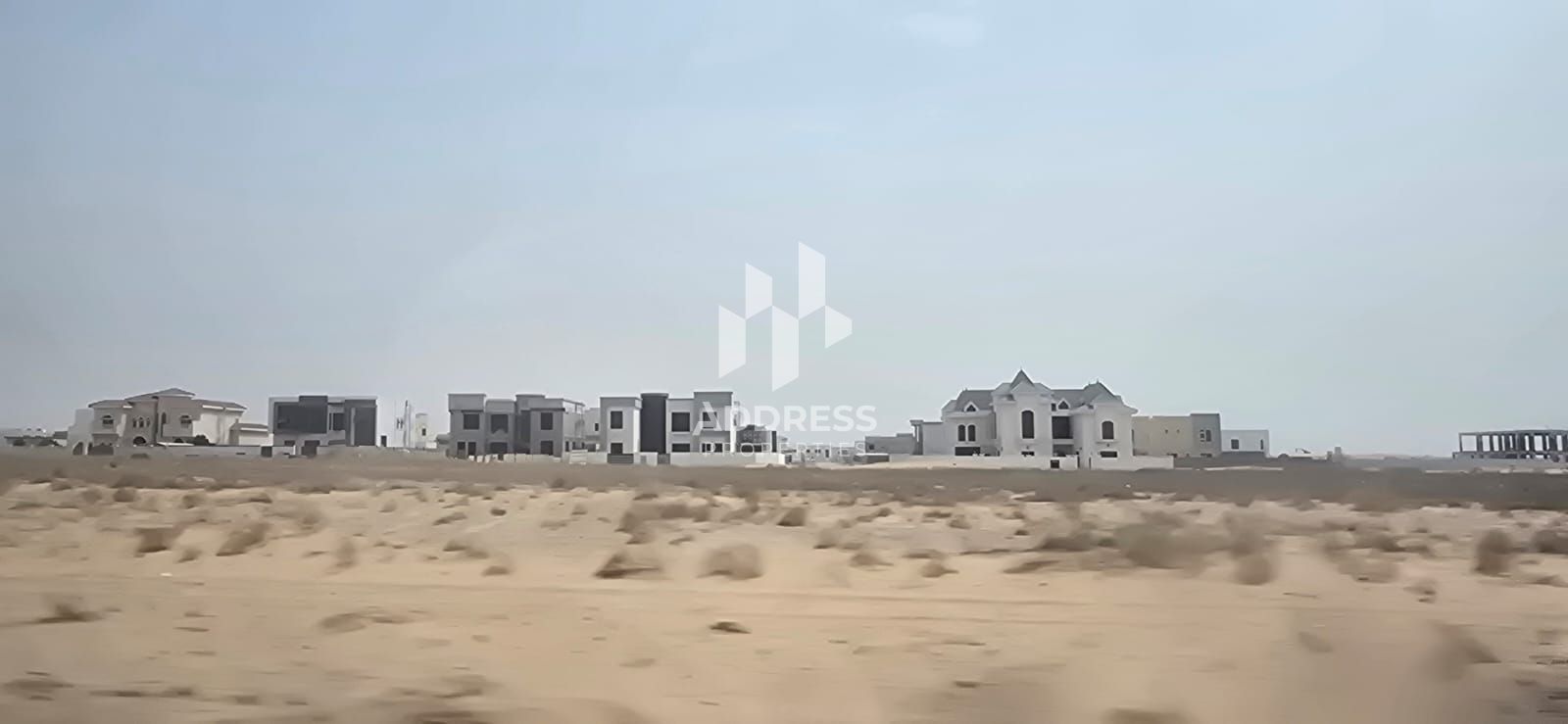 Commercial residential plot directly on the park and Khorfakkan Road – Rawdat Al Qarat, Sharjah – Prime location