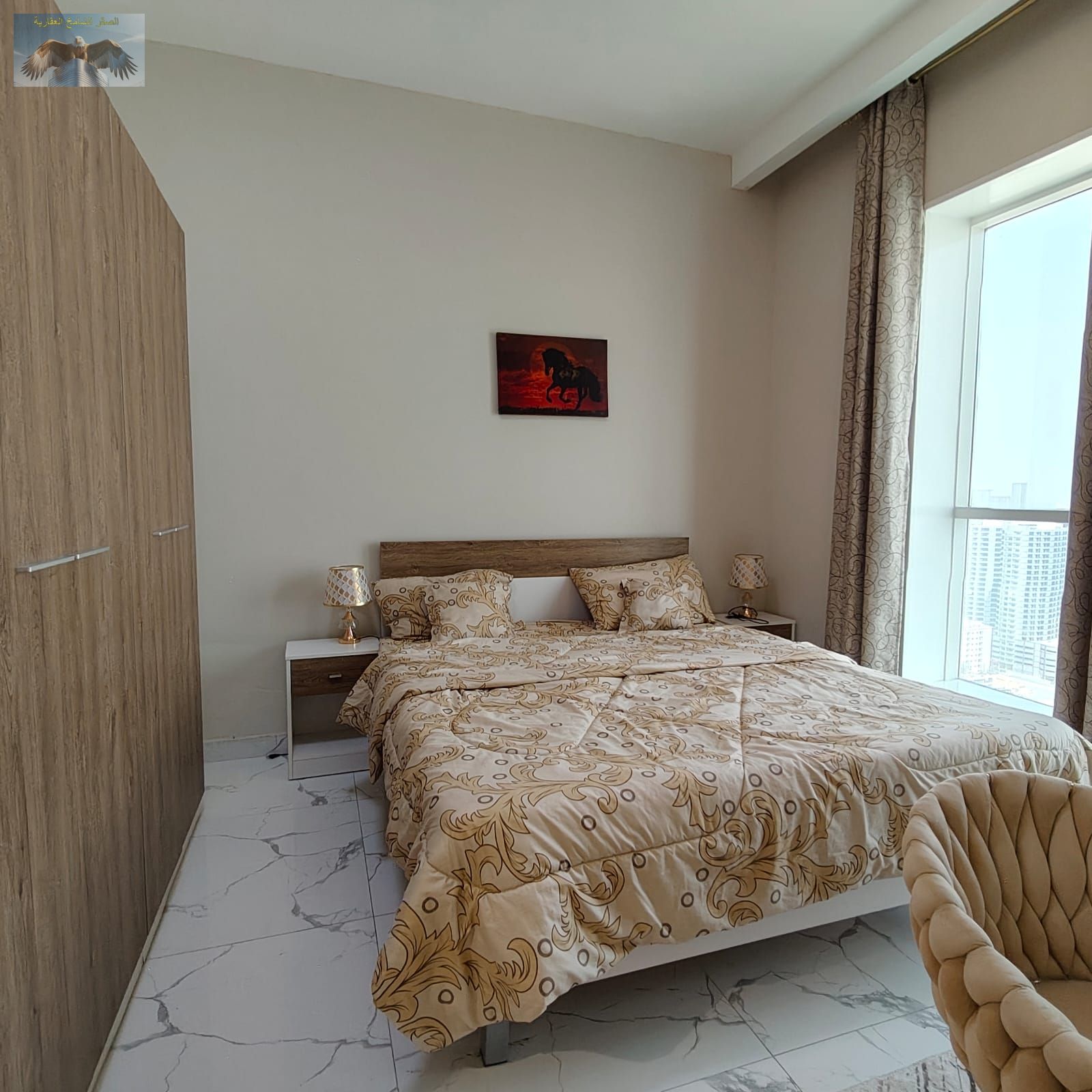 A furnished three-bedroom apartment with a living room and sea view for monthly rent in Al Waha Towers, Mina Street.