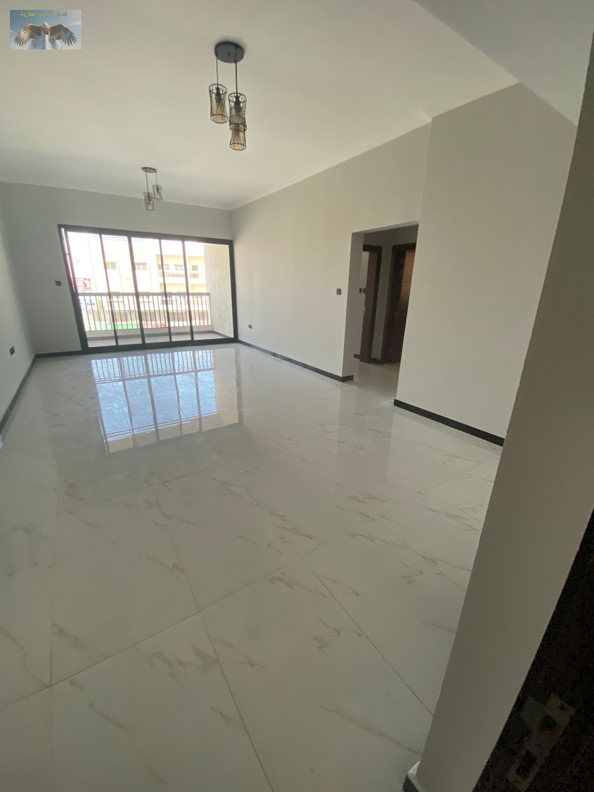 2BR apartment in Al Muweihat 3 Ajman near Al Shuwaifat School and Ajman Academy with 2 master bedrooms, external bathroom, balcony, built-in wardrobes