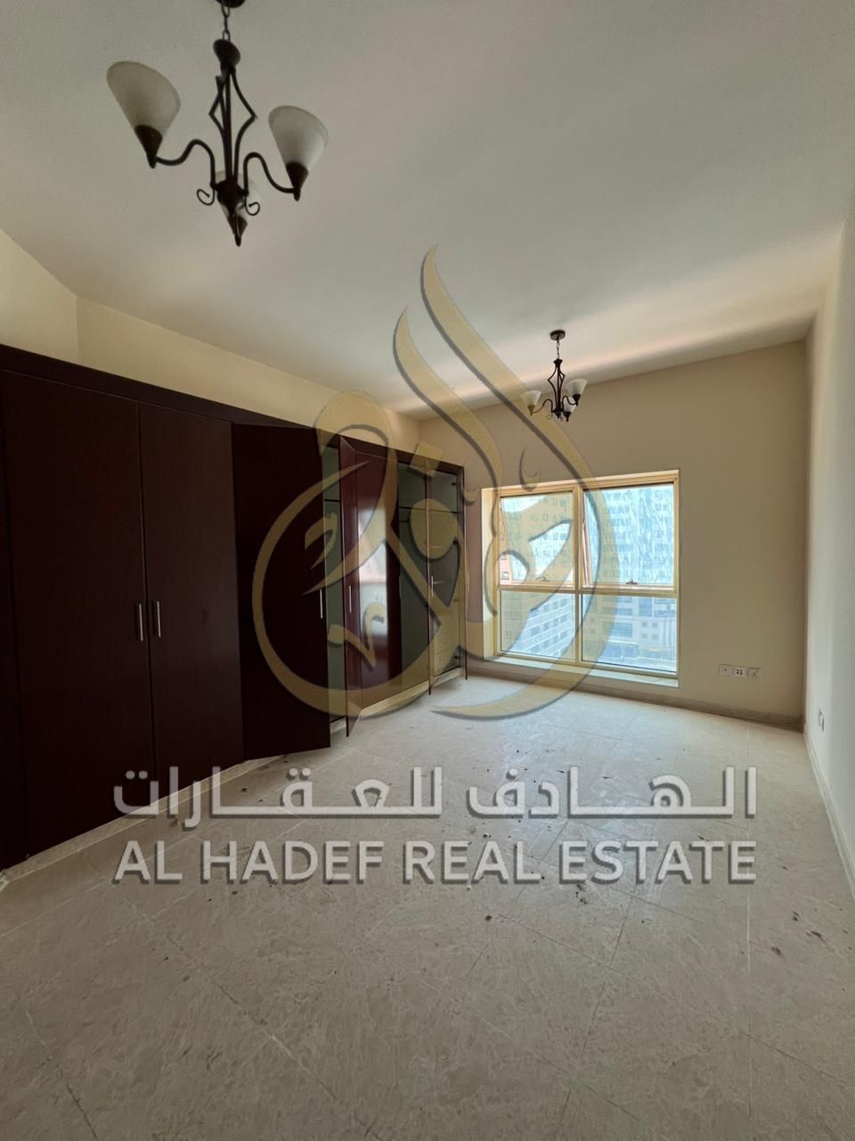 3-bedroom apartment with living room, storage room, and balcony - spacious - free air conditioning - gym and swimming pool - Al Taawun