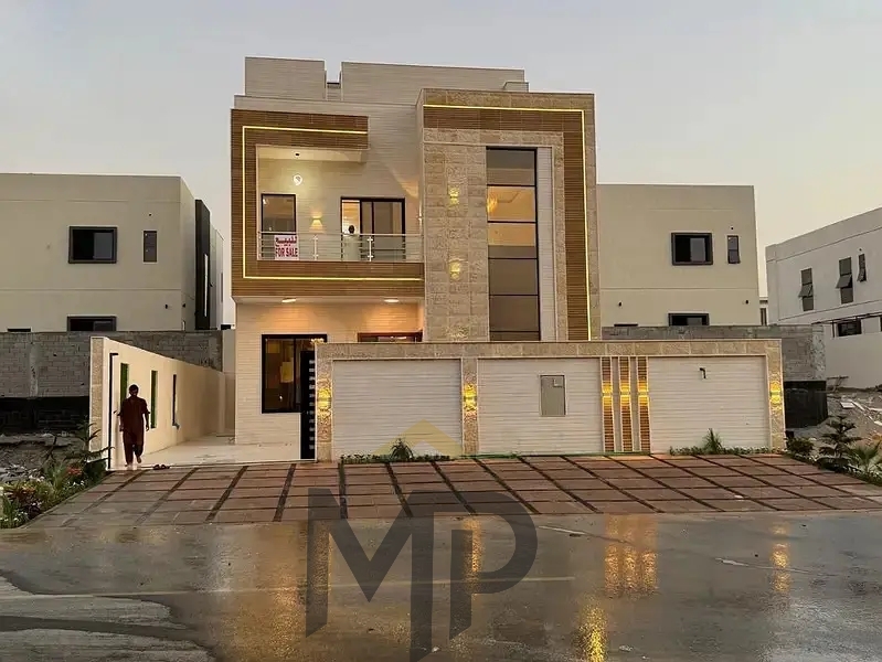 Villa with central location fees included, ready to move in, on the main street in one of Ajman's most prestigious areas.