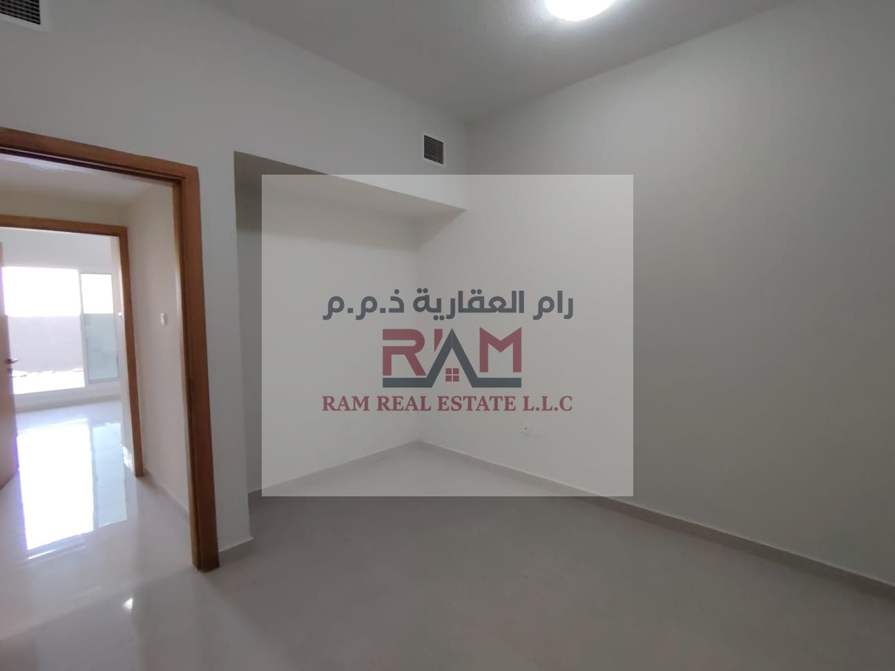 Two bedrooms and a living room in Gulf Tower, Emirates City