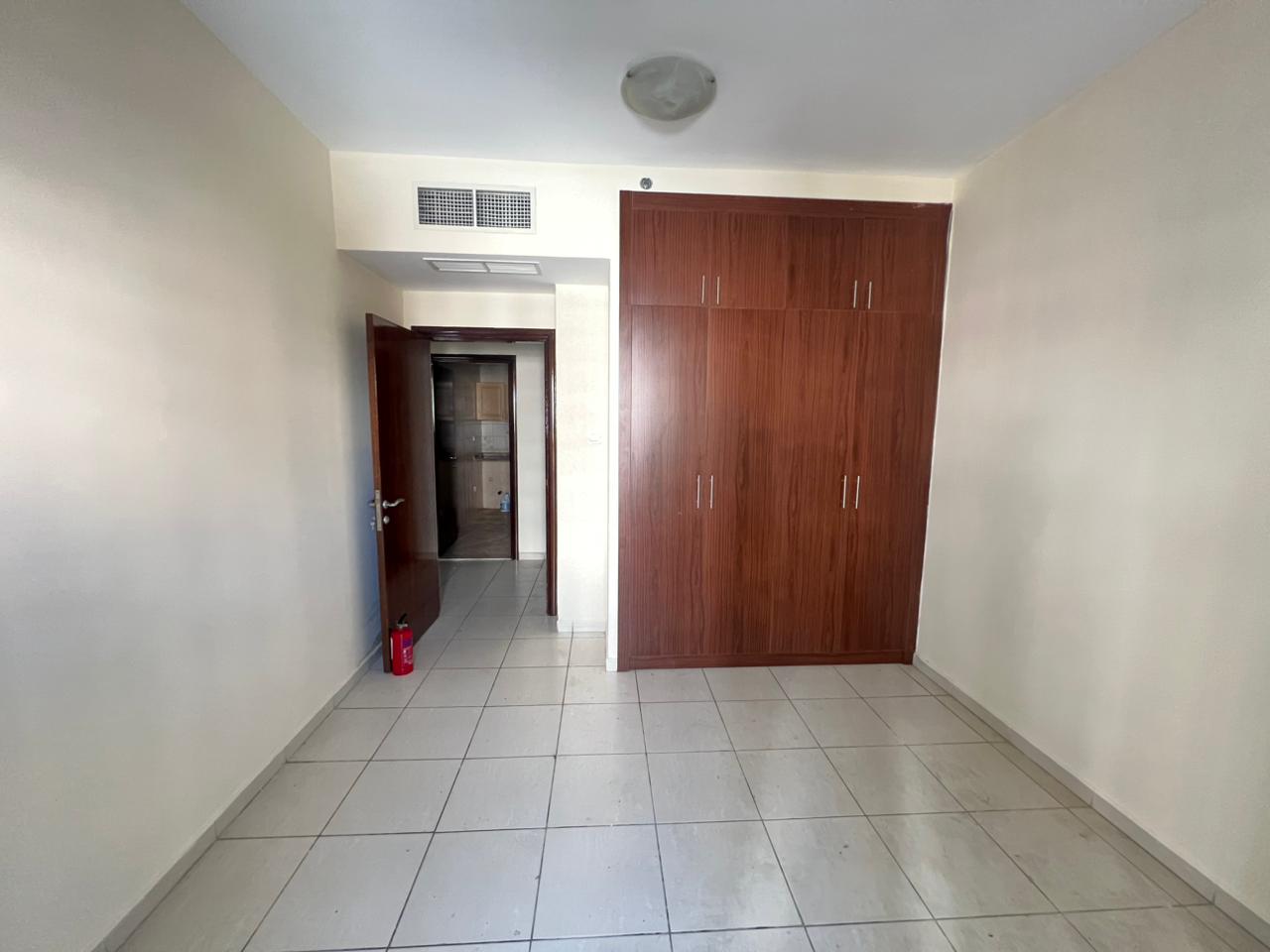 For rent: 1 bedroom & living room in Al Majaz 3 with free parking, balcony & wall closets, 40,000 AED/year, 4 installments, prime location near servic