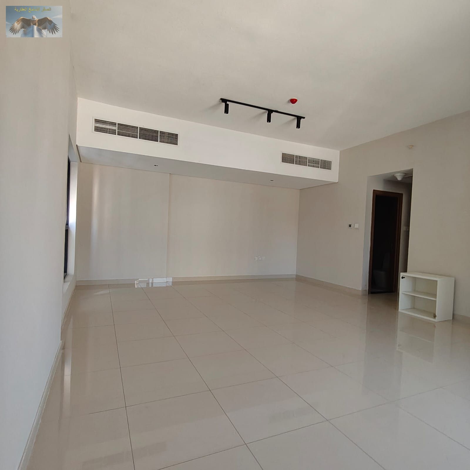 Three-bedroom apartment with a living room and maid's room for annual rent in Ajman. Prime location on Khalifa Street.