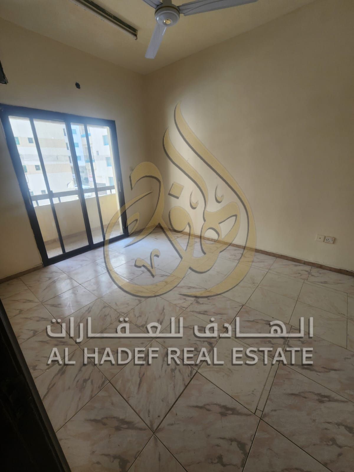 Cheapest two-bedroom apartment with hallway and enclosed living room + balcony - 2 bathrooms - on a main street in Al-Nabaa