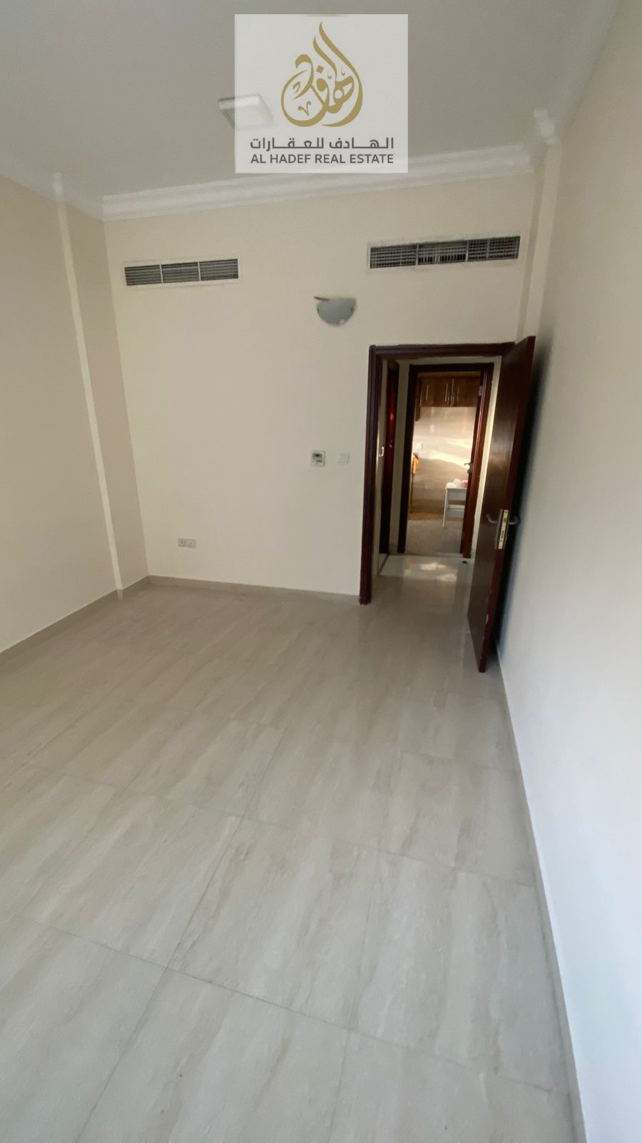 1 Bedroom Hall Apartment with 1 Bathroom and Separate Living Hall, Spacious Layout, Prime Location on a Main Street, and Open View.