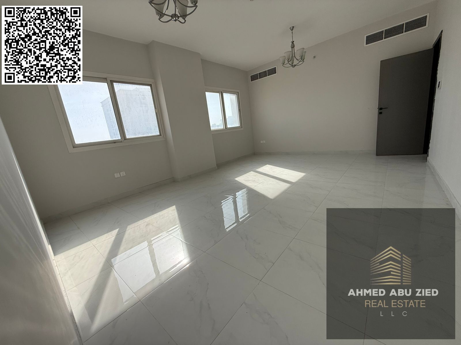 Two bedrooms and a separate living room with a spacious area in a new building, first occupancy, with free parking, 3 bathrooms, a distinctive balcony