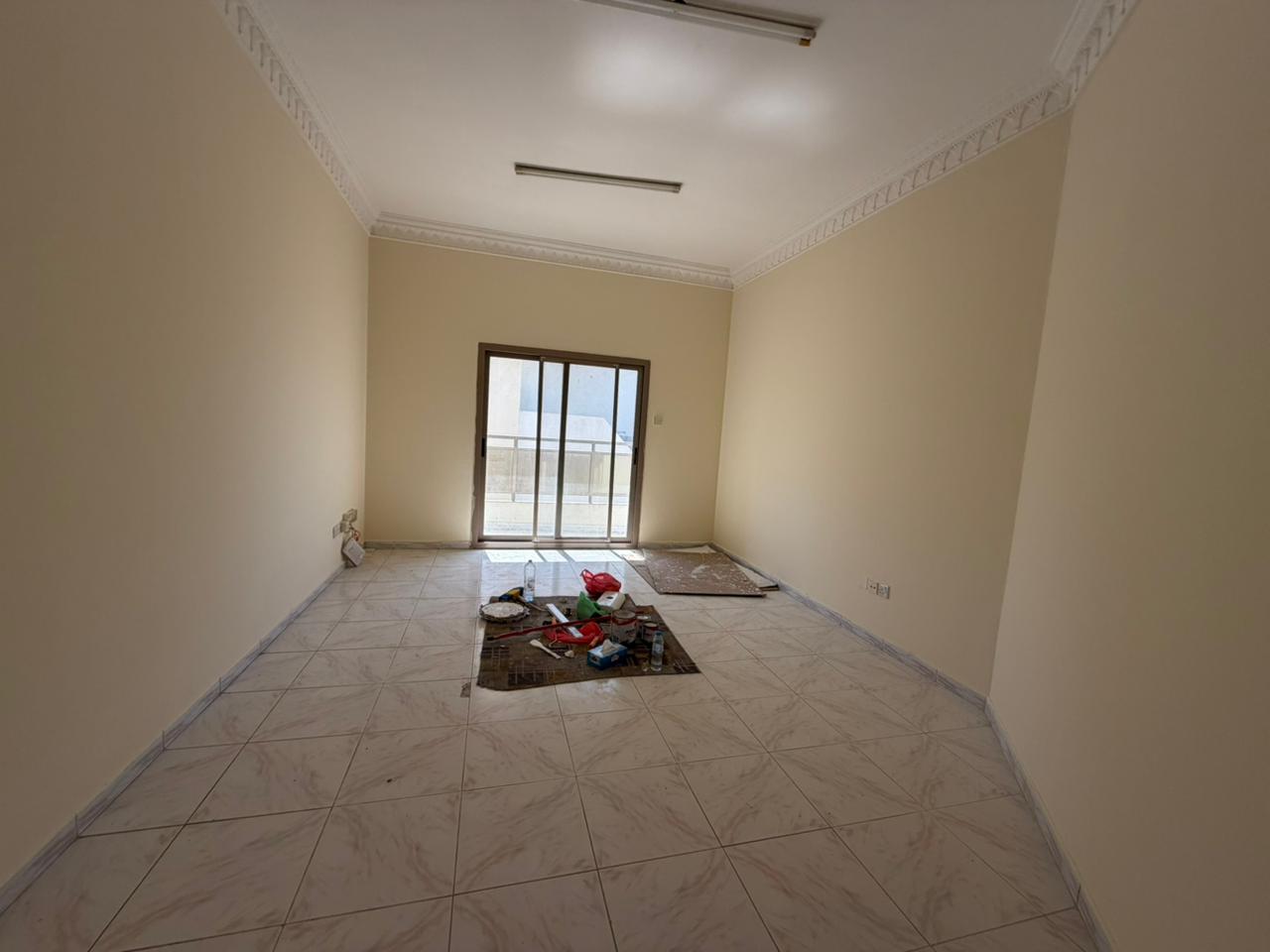 Balcony with a partial open view, spacious layout, bright kitchen, prime service-oriented location, close to Dubai exit.