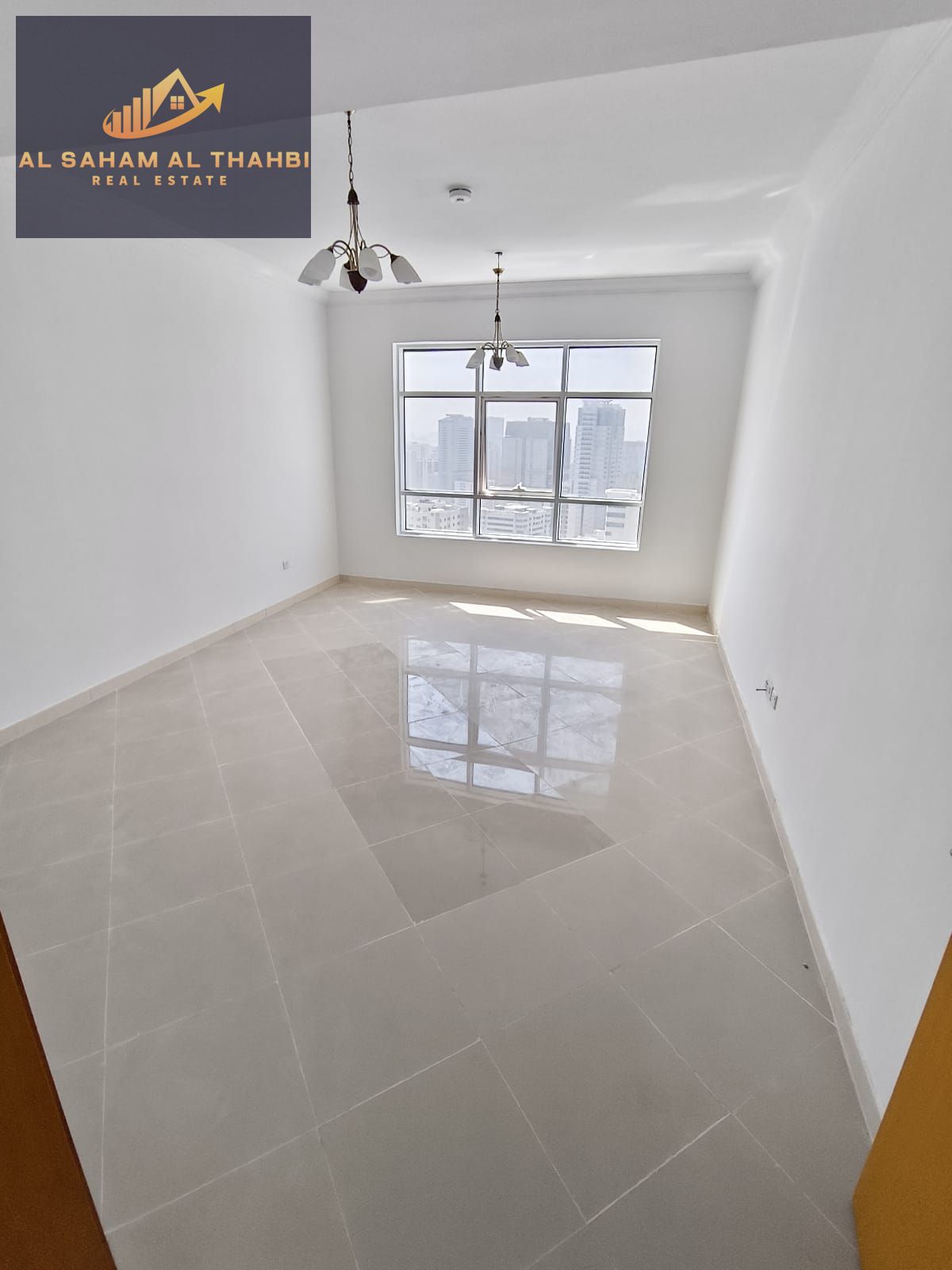 Two-bedroom apartment with a living room and balcony for rent in Al Taawun.