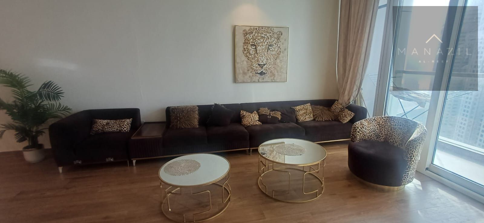Luxury two-bedroom apartment with a living room, high-end hotel-style furnishings.