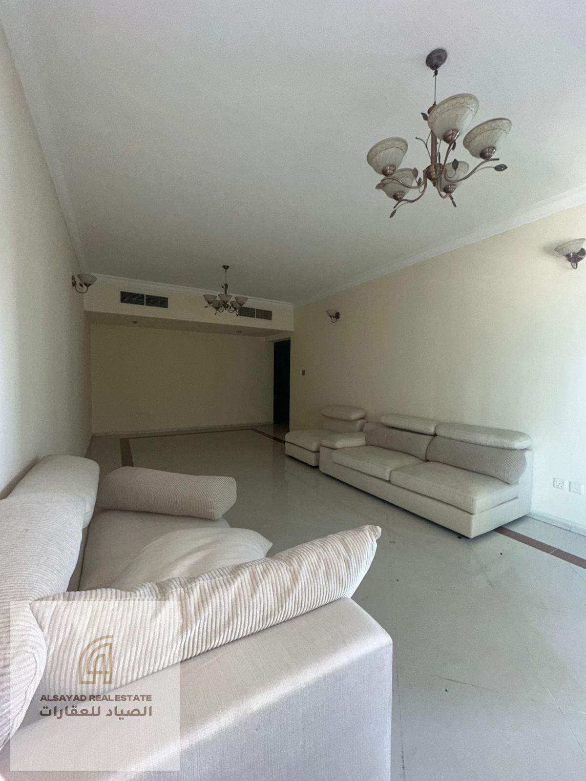 For sale: A spacious apartment consisting of 3 bedrooms, a living room, and a maid's room, with a side view of Al Mamzar beach.