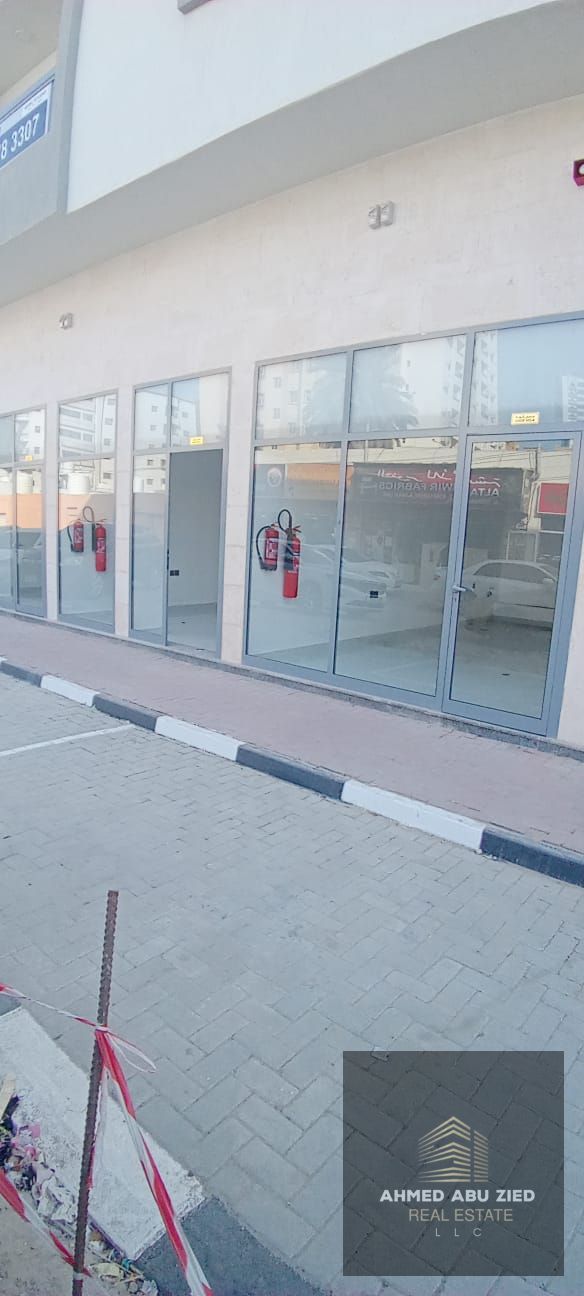 Spacious commercial shops for annual rent in Al Karama, Ajman, prime location near Al Nakheel and Corniche, ideal for all business activities, AED 60,