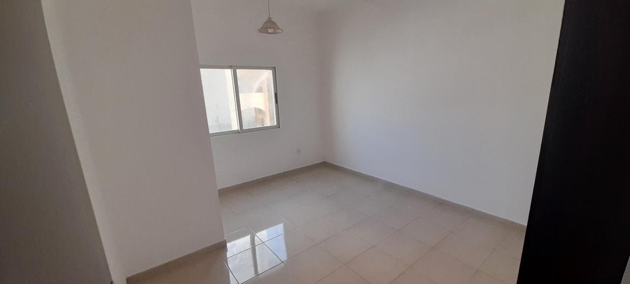 Two-bedroom apartment with living room, balcony, and central AC in Al Qasimia. Rent AED 38,000/year, 4 or 6 installments, 5% security cheque refundabl