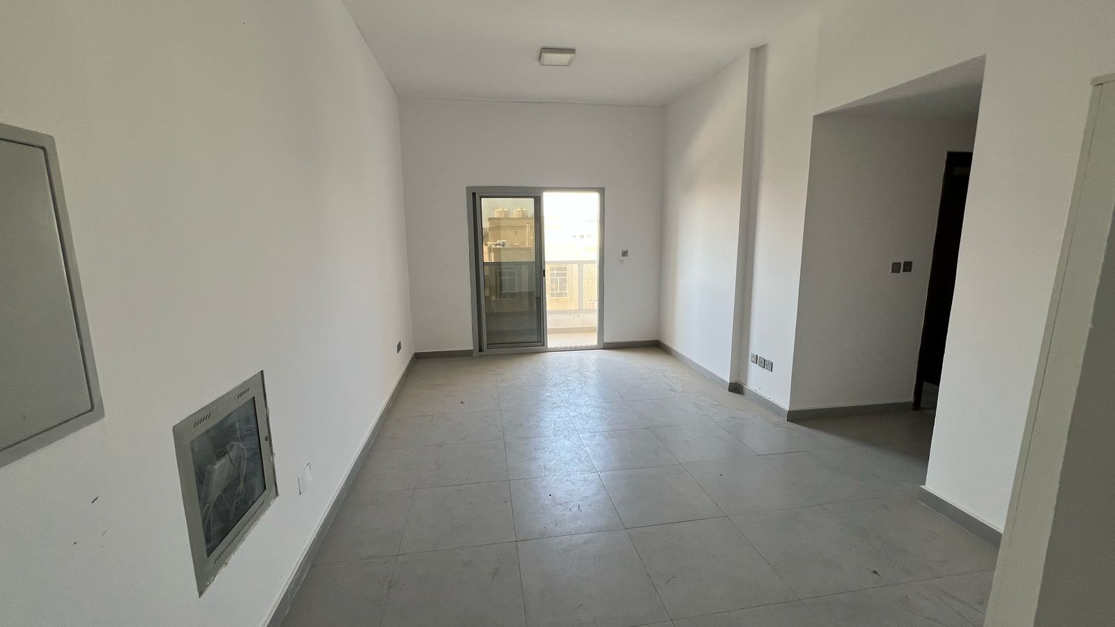 Two-bedroom apartment with a living room available for annual rent in Al Rawda, behind Al Hamidiya Police Station, near Kenz Mall and the extension of