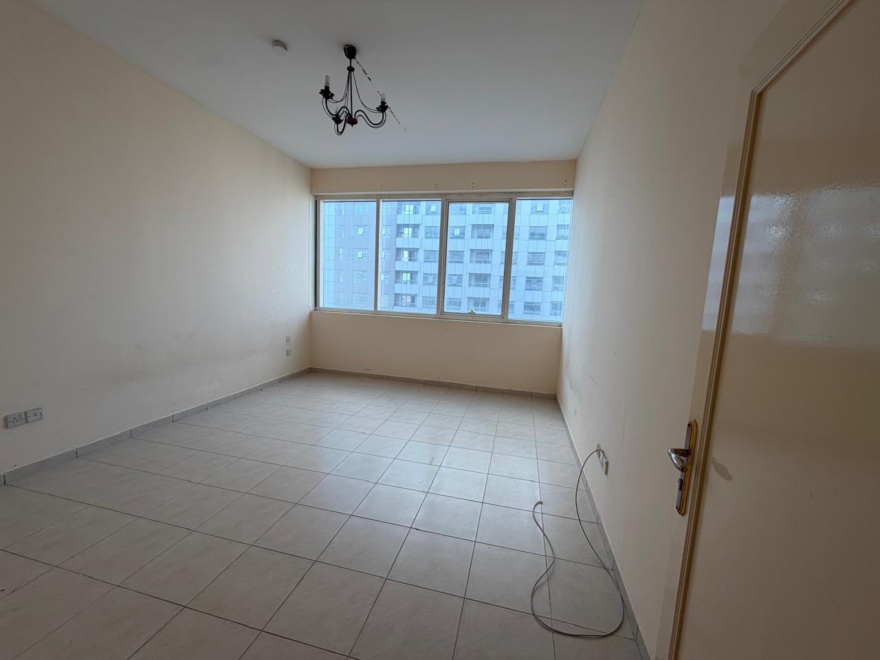 2-Bedroom Apartment in Al Taawun – Free AC, Built-in Cabinets, Prime Location Near Malls & Services