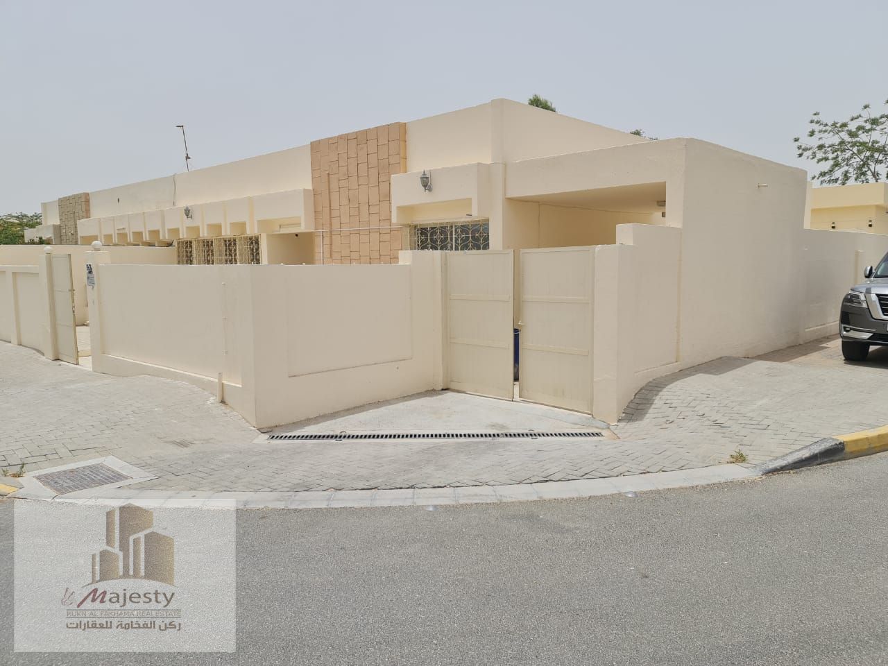 Two twin houses for sale in Al Ramla, corner lot on two streets, on a 10,000 square foot plot.