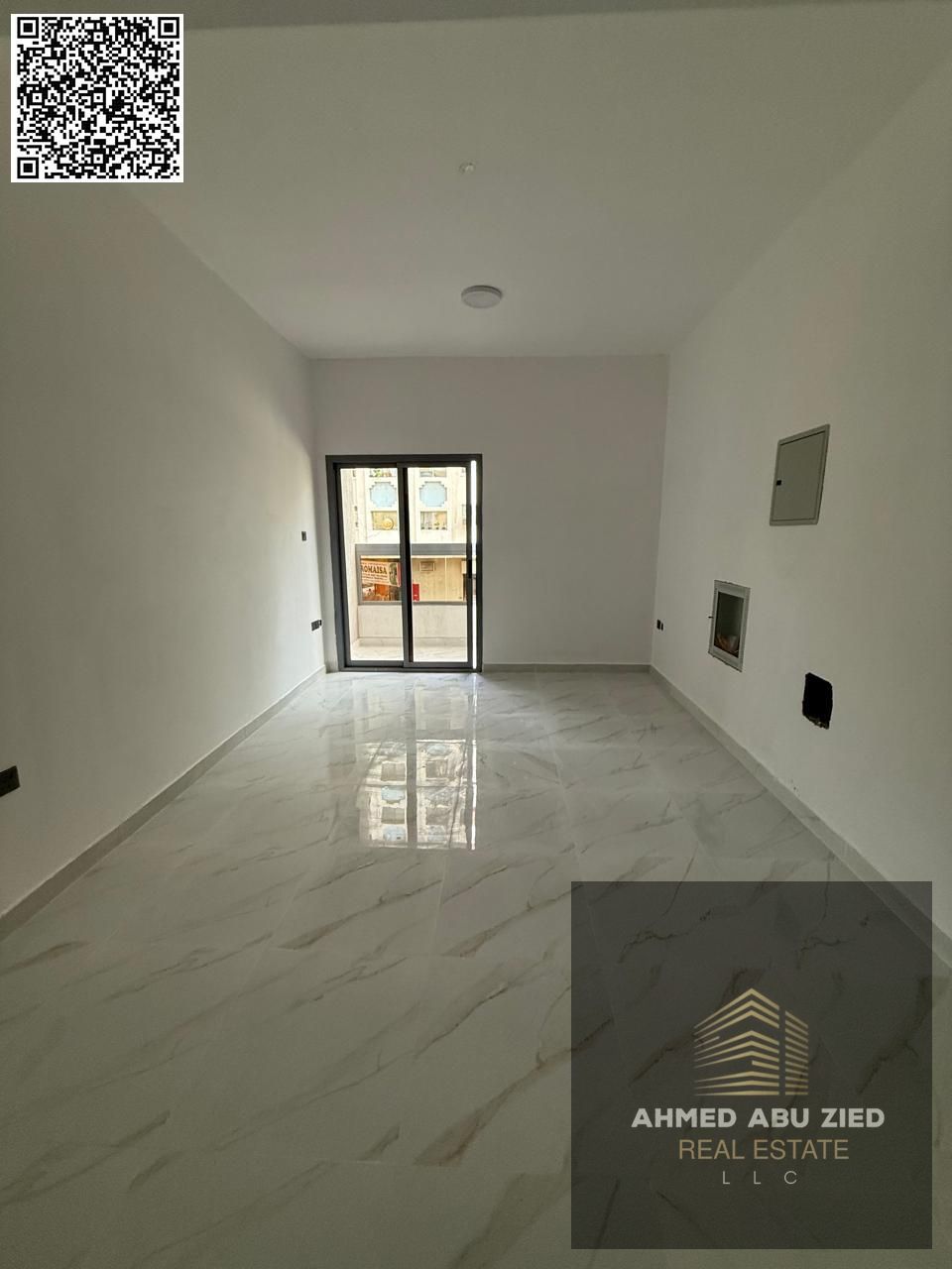One bedroom and living room, first occupancy, new building, with 2 bathrooms, equipped kitchen, and a distinctive balcony with an open view in Al Kara