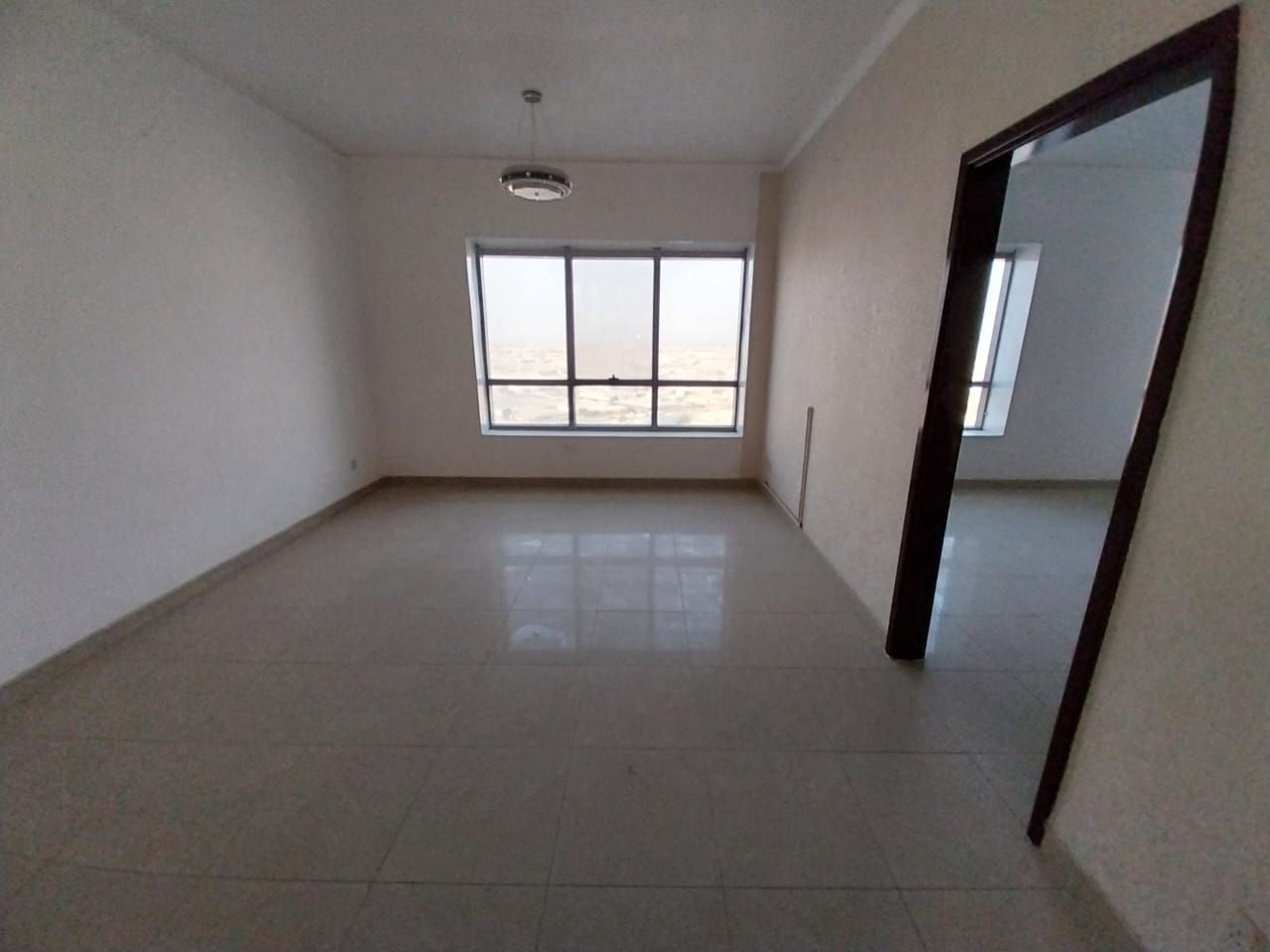 The most elegant and luxurious one-bedroom apartment with living room and parking, prime location directly on Dubai exit, spacious area.