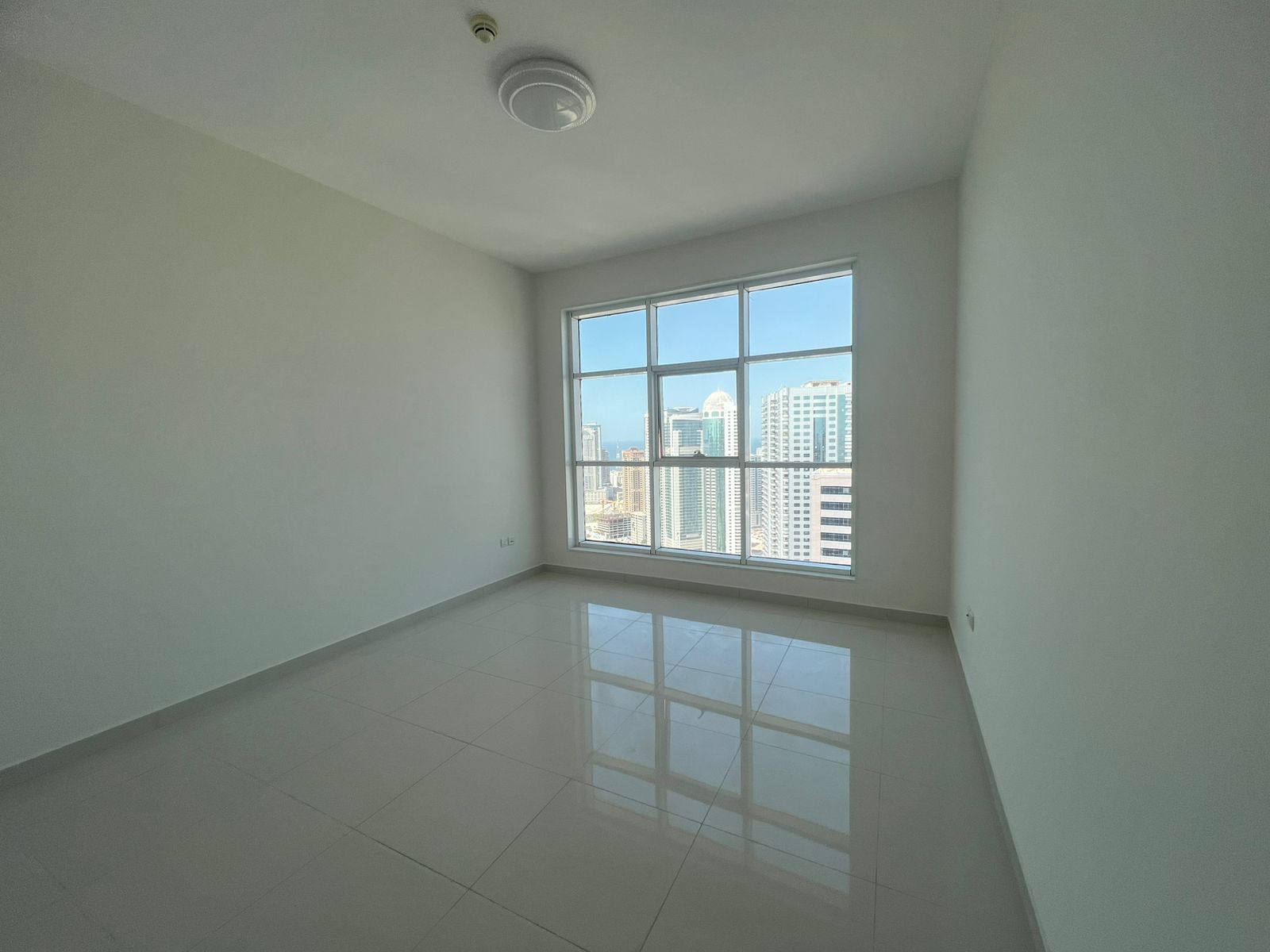 One-bedroom apartment in Al Khan Tower with free AC, gym, pool, and parking. Rent AED 55,000/year, 4 installments, ready to move in.