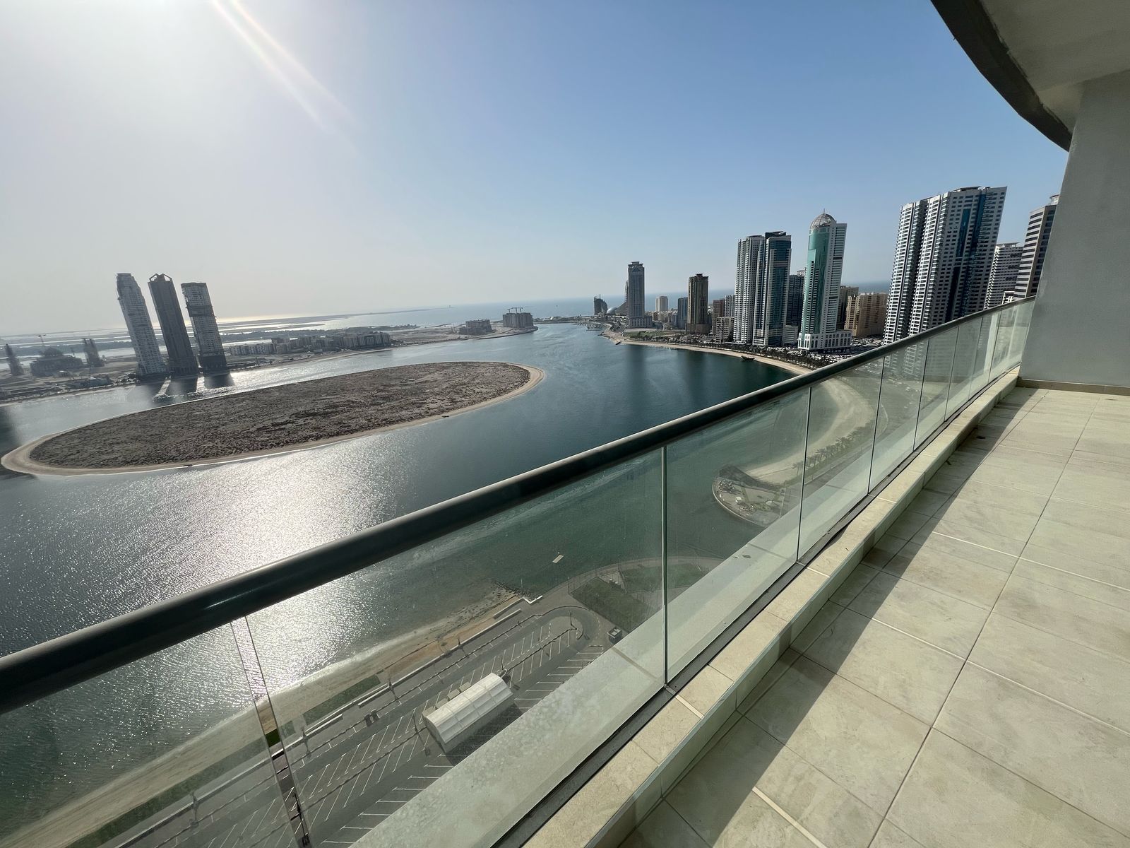 Direct sea view, owner-paid AC, parking, gym, pool, built-in closets, maid’s room, large balcony