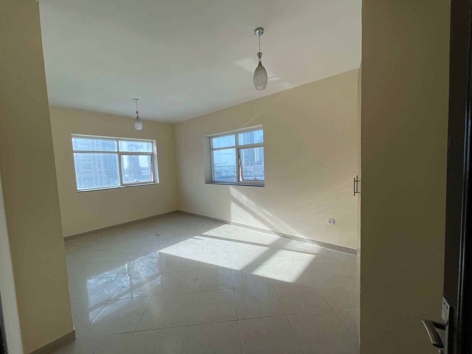 Free Parking – 2 Bedrooms + Hall – Balcony with Open View – 4 Cheques – Security Deposit – Spacious – Family Tower – Near Dubai Exit