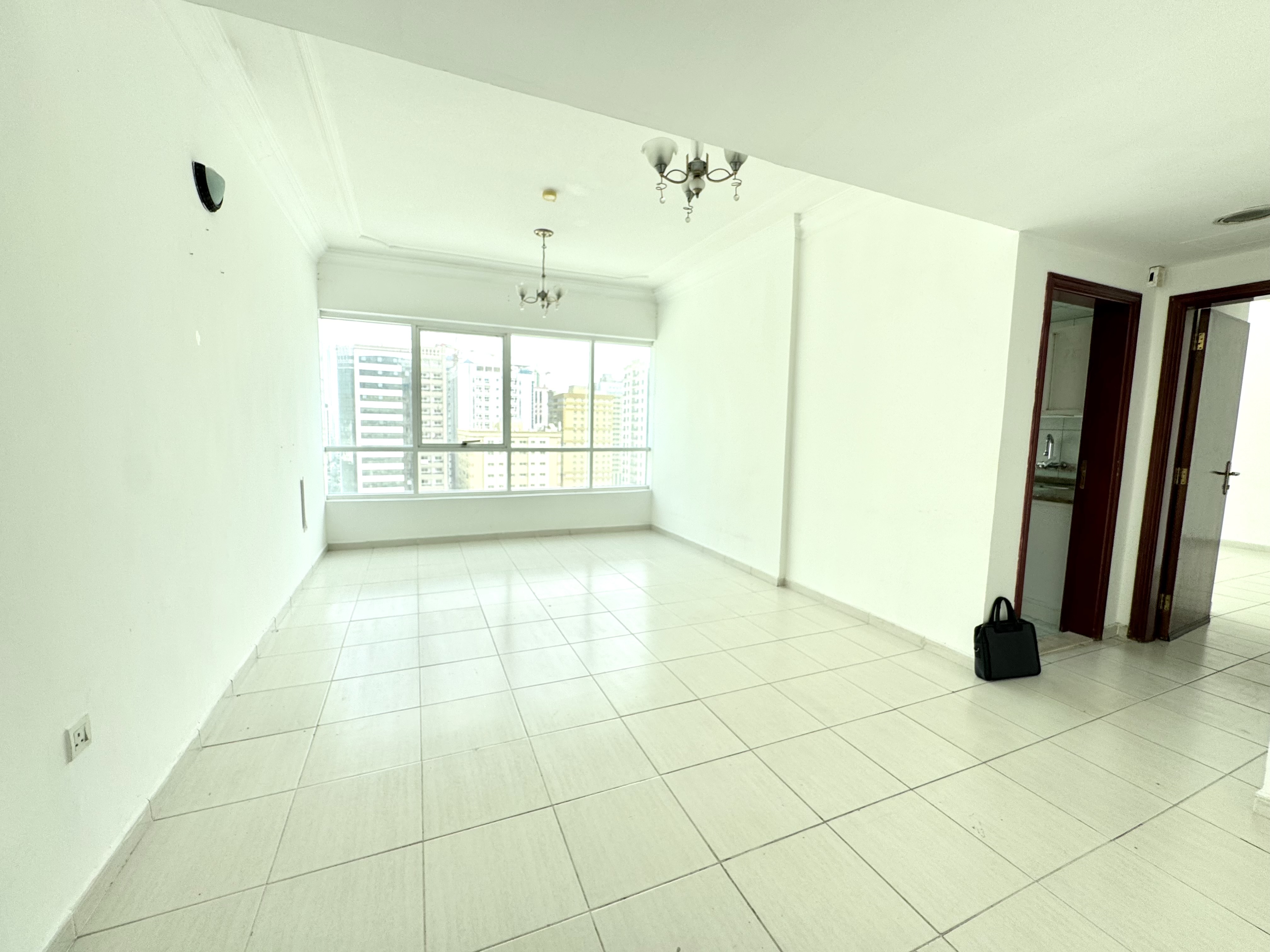 Stylish 1 BHK apartment with a balcony, built-in wardrobe, full glass windows, and access to a gym and pool—bright, comfortable, and modern livin